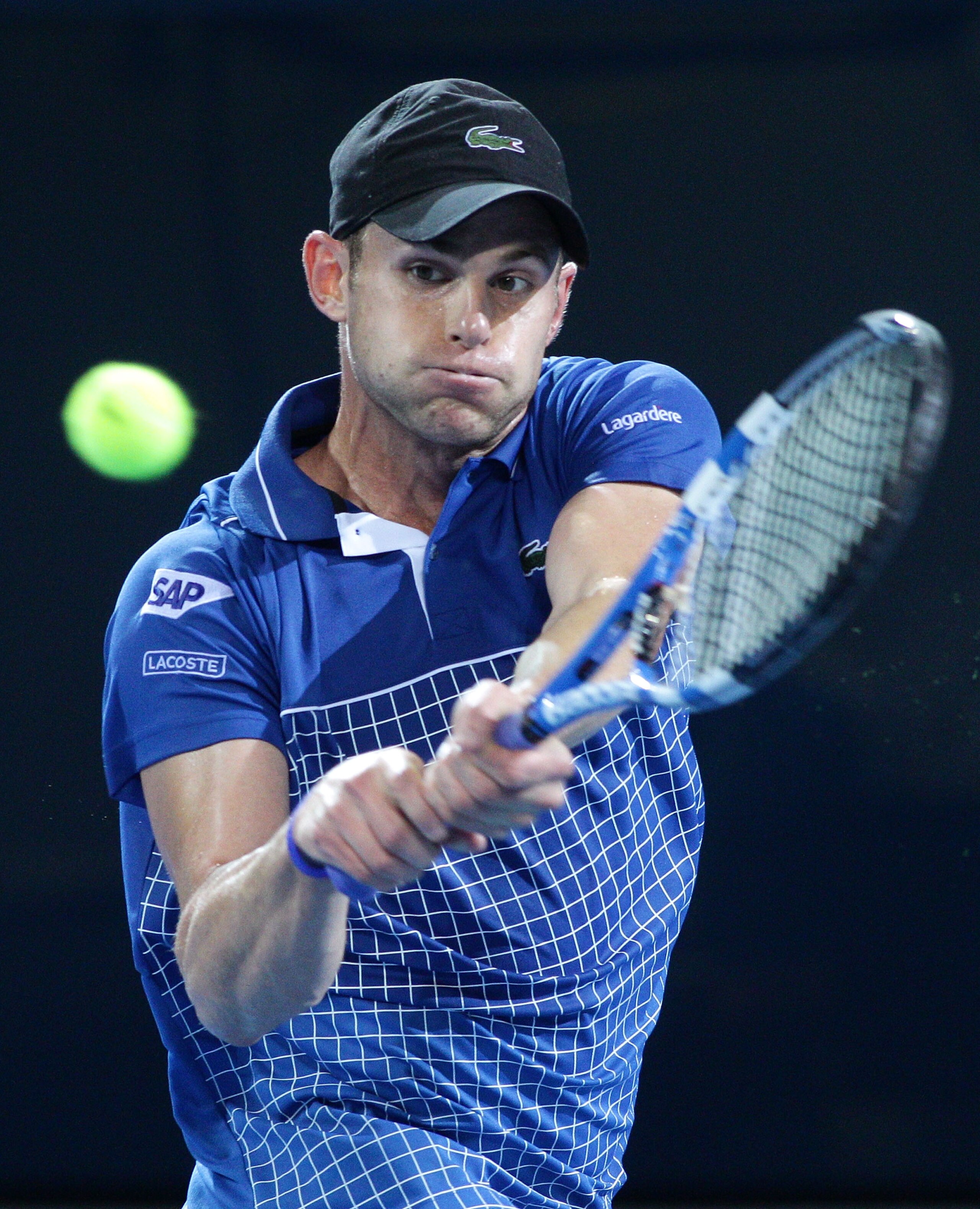 BRISBANE, AUSTRALIA - JANUARY 03:  Andy Roddick of the USA plays a backhand during his first round match against Marinko Matosevic of Australia during day two of the Brisbane International at Queensland Tennis Centre on January 3, 2011 in Brisbane, Austra