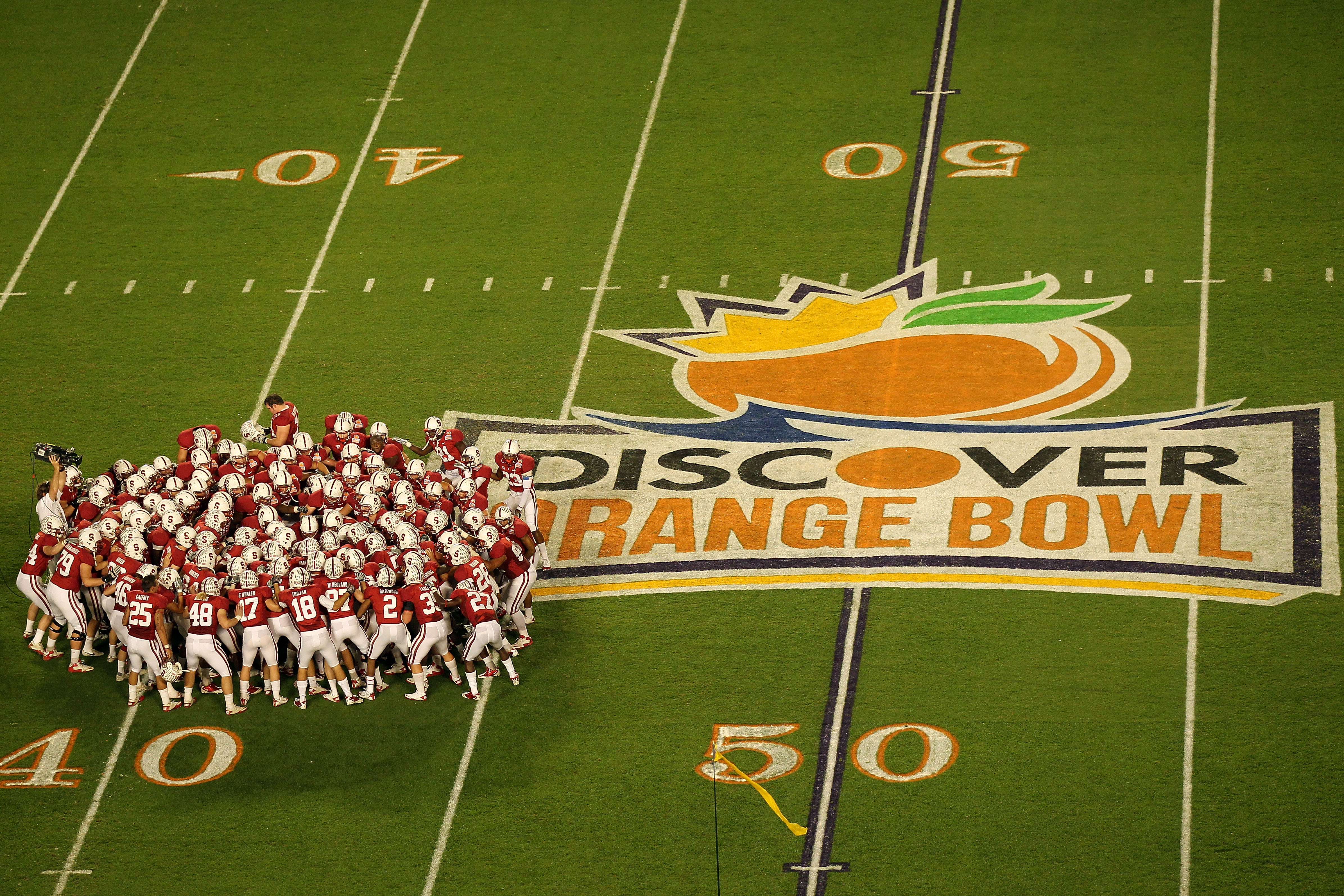 MIAMI, FL - JANUARY 03:  The Stanford Cardinal huddle on the field prior to playing against the Virginai Tech Hokies during the 2011 Discover Orange Bowl at Sun Life Stadium on January 3, 2011 in Miami, Florida.  (Photo by Mike Ehrmann/Getty Images)