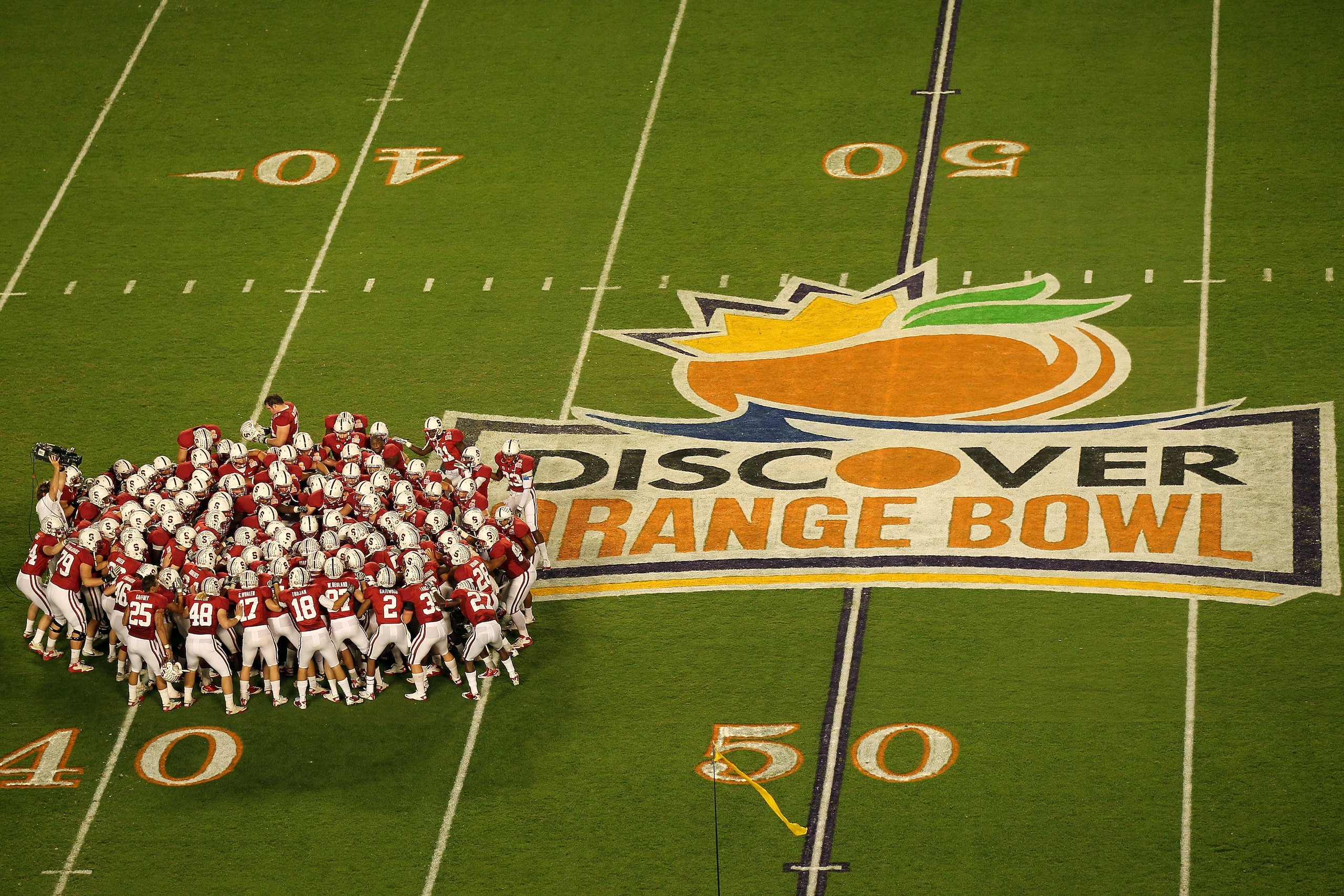 MIAMI, FL - JANUARY 03: The Stanford Cardinal huddle on the field prior to playing against the Virginai Tech Hokies during the 2011 Discover Orange Bowl at Sun Life Stadium on January 3, 2011 in Miami, Florida. (Photo by Mike Ehrmann/Getty Images) MIAMI, FL - JANUARY 03: The Stanford Cardinal huddle on the field prior to playing against the Virginai Tech Hokies during the 2011 Discover Orange Bowl at Sun Life Stadium on January 3, 2011 in Miami, Florida. (Photo by Mike Ehrmann/Getty Images)