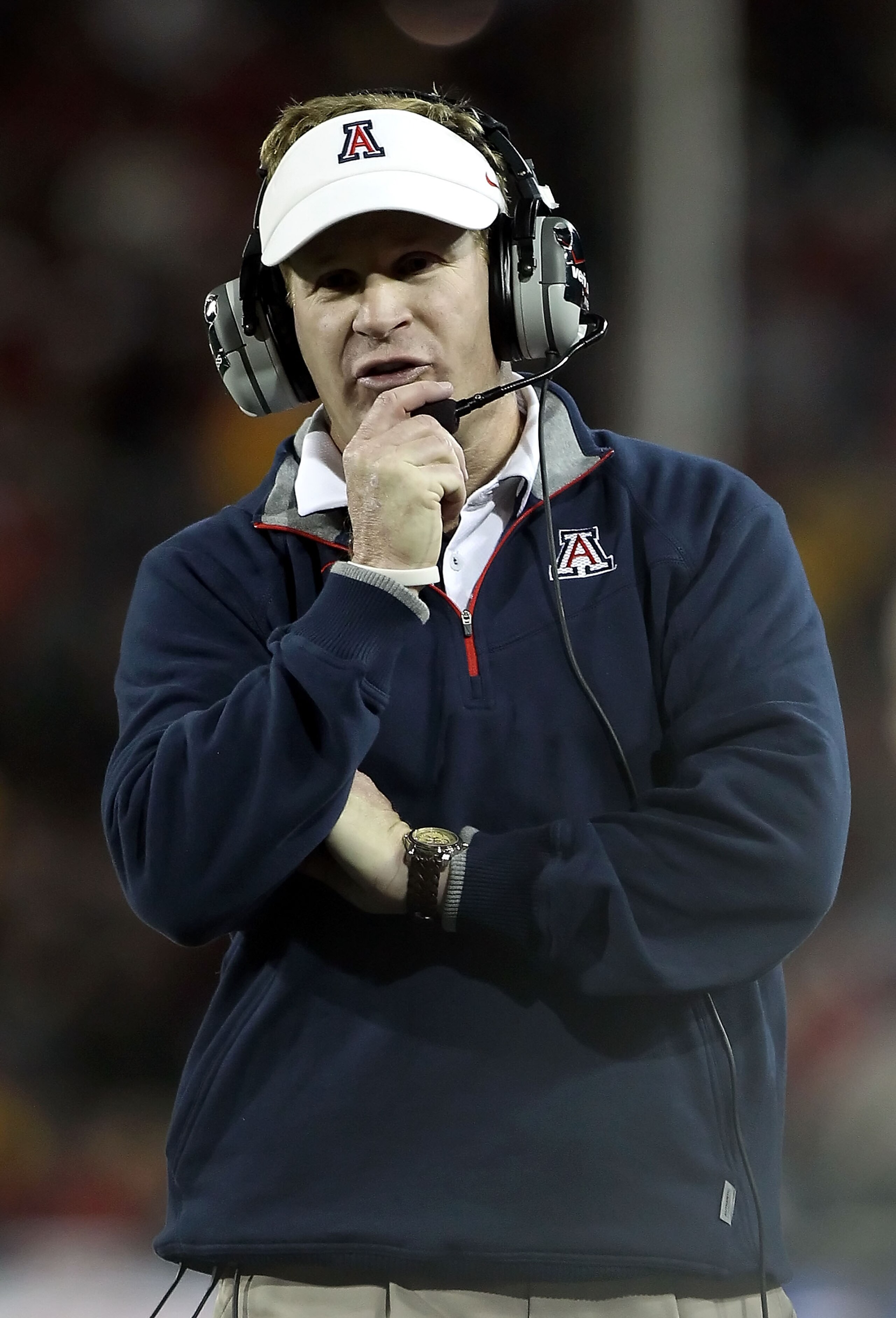 TUCSON, AZ - DECEMBER 02: Head coach Mike Stoops of the Arizona Wildcats during the college football game against the Arizona State Sun Devils at Arizona Stadium on December 2, 2010 in Tucson, Arizona. The Sun Devils defeated the Wildcats 30-29 in double TUCSON, AZ - DECEMBER 02: Head coach Mike Stoops of the Arizona Wildcats during the college football game against the Arizona State Sun Devils at Arizona Stadium on December 2, 2010 in Tucson, Arizona. The Sun Devils defeated the Wildcats 30-29 in double