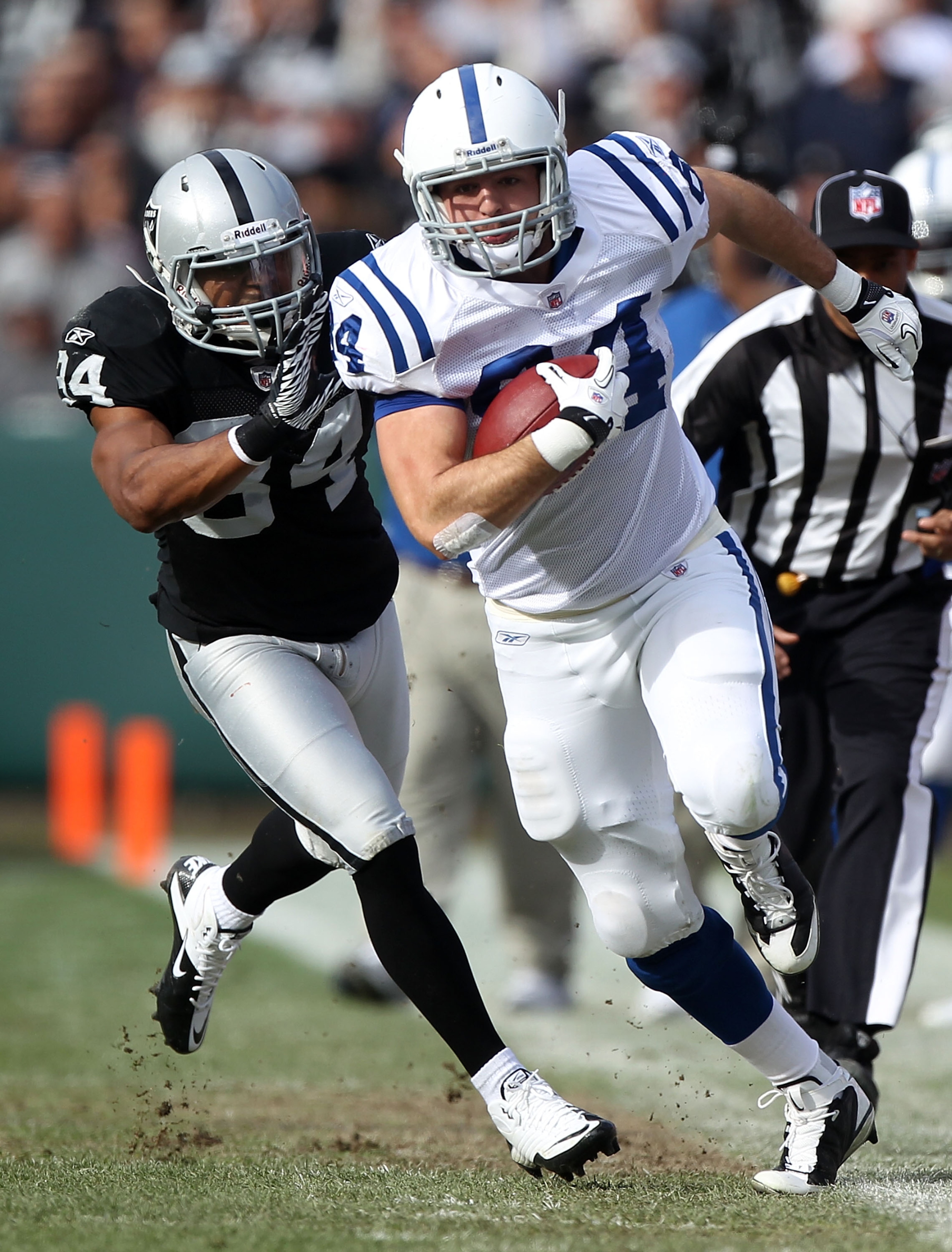OAKLAND, CA - DECEMBER 26: Jacob Tamme #84 of the Indianapolis Colts runs after a catch past Mike Mitchell #34 of the Oakland Raiders during an NFL game at Oakland-Alameda County Coliseum on December 26, 2010 in Oakland, California. (Photo by Jed Jacob OAKLAND, CA - DECEMBER 26: Jacob Tamme #84 of the Indianapolis Colts runs after a catch past Mike Mitchell #34 of the Oakland Raiders during an NFL game at Oakland-Alameda County Coliseum on December 26, 2010 in Oakland, California. (Photo by Jed Jacob