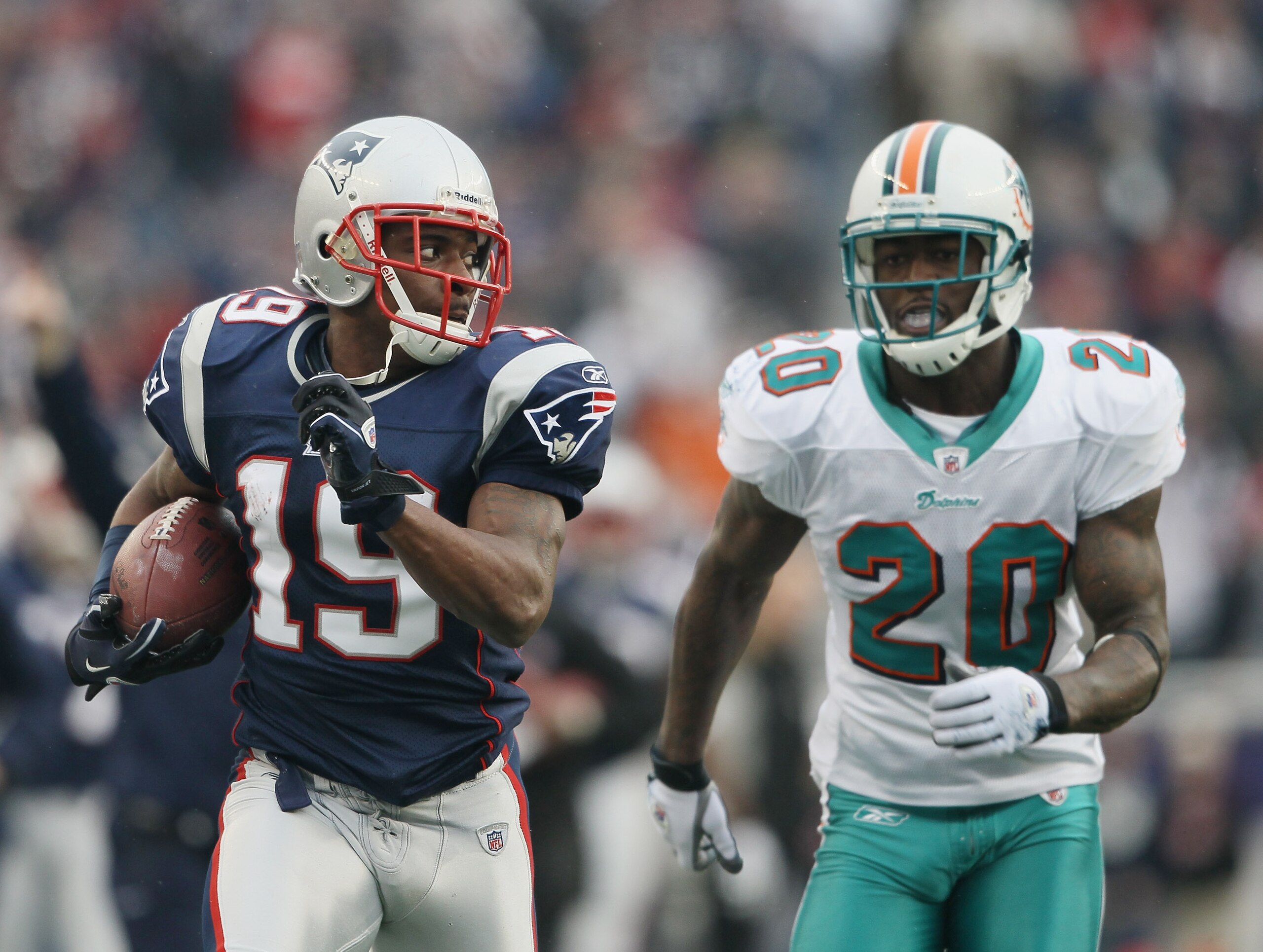 FOXBORO, MA - JANUARY 02: Brandon Tate #19 of the New England Patriots carries the ball as Reshad Jones #20 of the Miami Dolphins chases after him on January 2, 2011 at Gillette Stadium in Foxboro, Massachusetts. (Photo by Elsa/Getty Images) FOXBORO, MA - JANUARY 02: Brandon Tate #19 of the New England Patriots carries the ball as Reshad Jones #20 of the Miami Dolphins chases after him on January 2, 2011 at Gillette Stadium in Foxboro, Massachusetts. (Photo by Elsa/Getty Images)