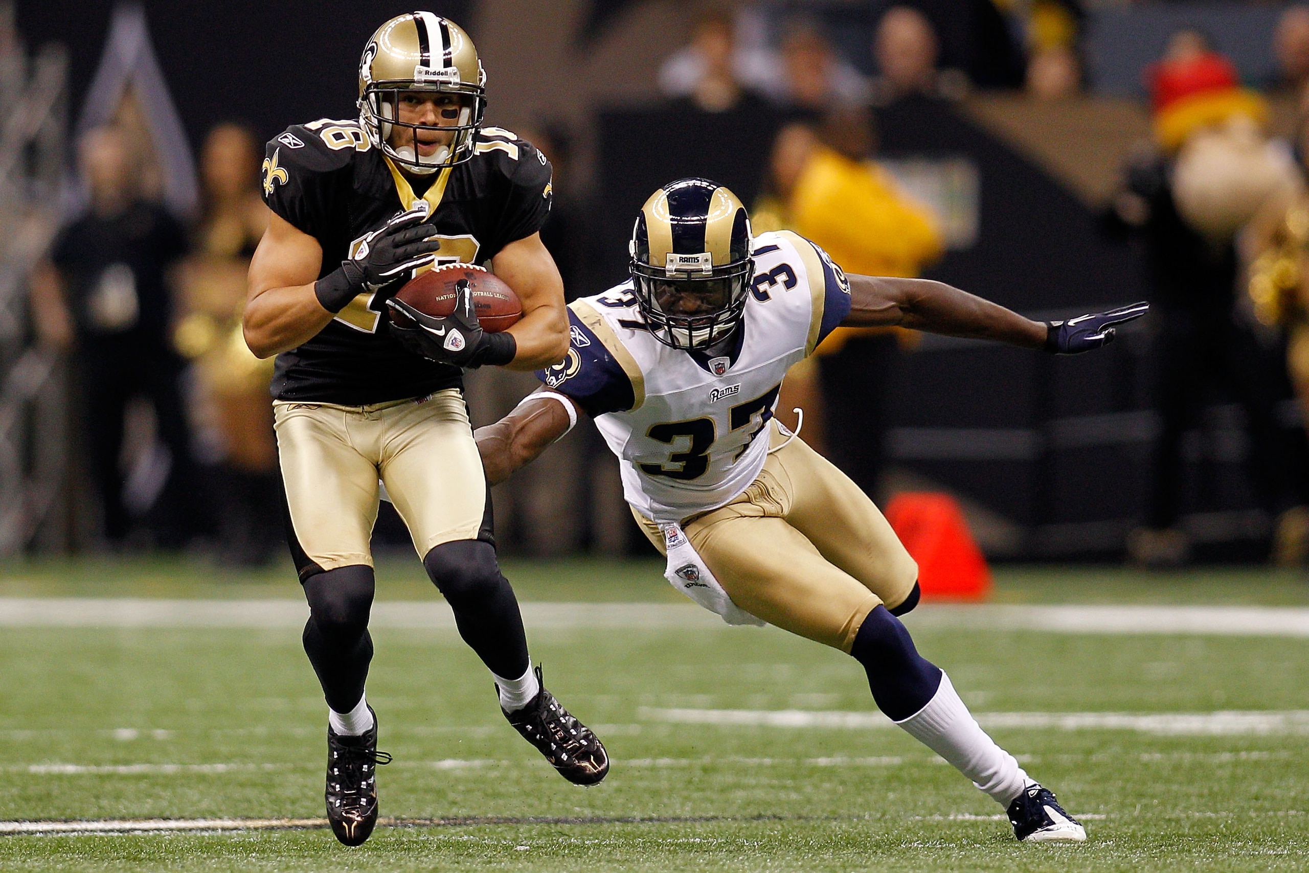 NEW ORLEANS, LA - DECEMBER 12: Lance Moore #16 of the New Orleans Saints avoids a tackle by James Butler #37 of the St. Louis Rams at the Louisiana Superdome on December 12, 2010 in New Orleans, Louisiana. The Saints defeated the Rams 31-13. (Photo by C NEW ORLEANS, LA - DECEMBER 12: Lance Moore #16 of the New Orleans Saints avoids a tackle by James Butler #37 of the St. Louis Rams at the Louisiana Superdome on December 12, 2010 in New Orleans, Louisiana. The Saints defeated the Rams 31-13. (Photo by C