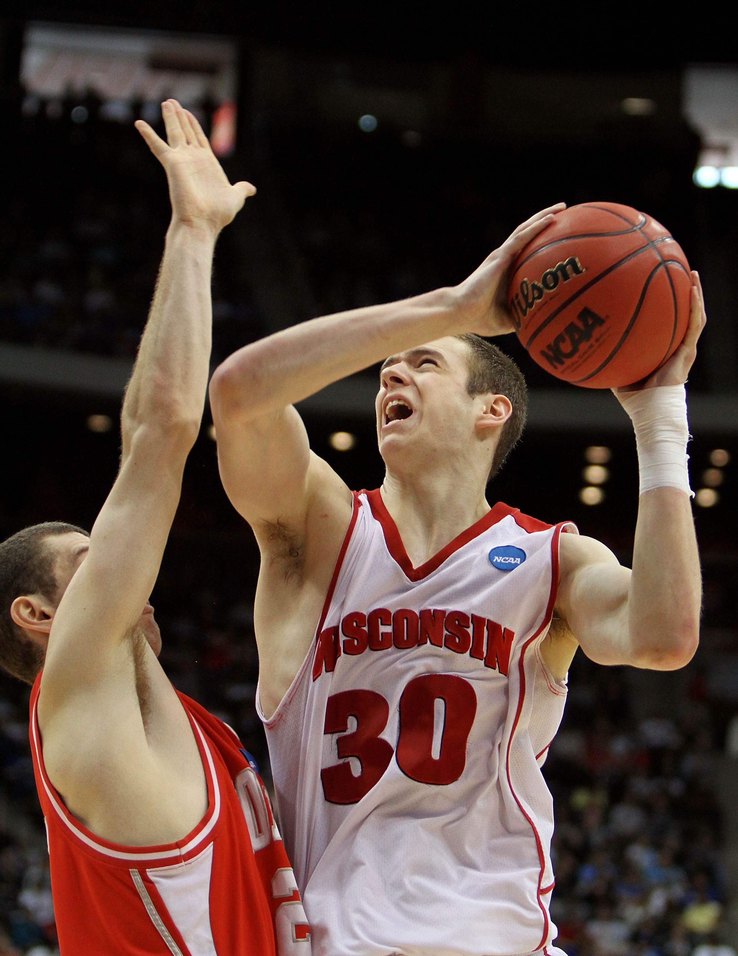 JACKSONVILLE, FL - MARCH 21: Jon Leuer #30 of the Cornell Big Red drives over Jon Jaques #25 of the Wisconsin Badgers during the second round of the 2010 NCAA men's basketball tournament at Jacksonville Veteran's Memorial Arena on March 21, 2010 in Jacks JACKSONVILLE, FL - MARCH 21: Jon Leuer #30 of the Cornell Big Red drives over Jon Jaques #25 of the Wisconsin Badgers during the second round of the 2010 NCAA men's basketball tournament at Jacksonville Veteran's Memorial Arena on March 21, 2010 in Jacks