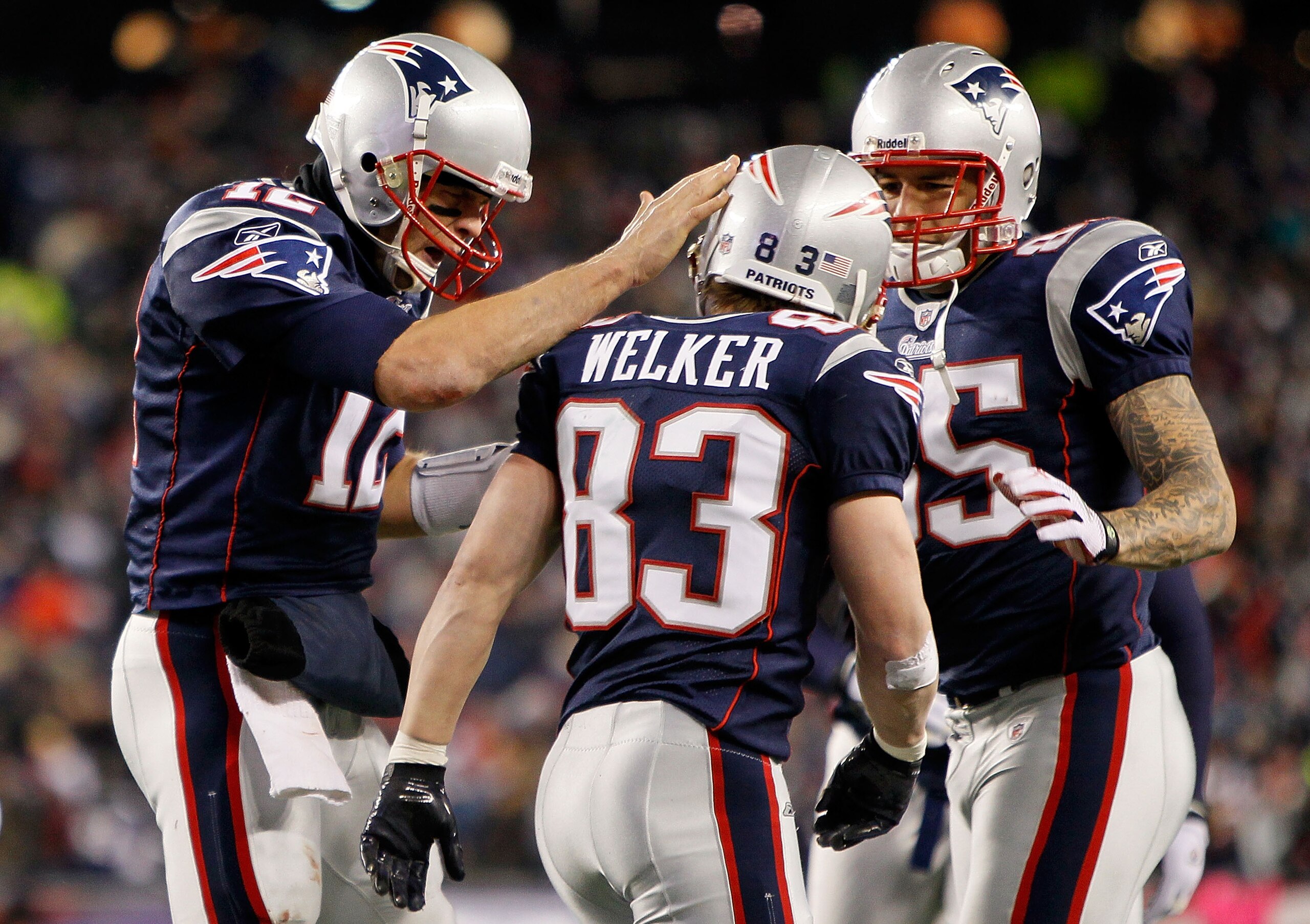 FOXBORO, MA - DECEMBER 06: (L-R) Tom Brady #12, Wes Welker #83 and Aaron Hernandez #85 of the New England Patriots celebrate after Welker scored a touchdown in the third quarter against the New York Jets at Gillette Stadium on December 6, 2010 in Foxboro FOXBORO, MA - DECEMBER 06: (L-R) Tom Brady #12, Wes Welker #83 and Aaron Hernandez #85 of the New England Patriots celebrate after Welker scored a touchdown in the third quarter against the New York Jets at Gillette Stadium on December 6, 2010 in Foxboro