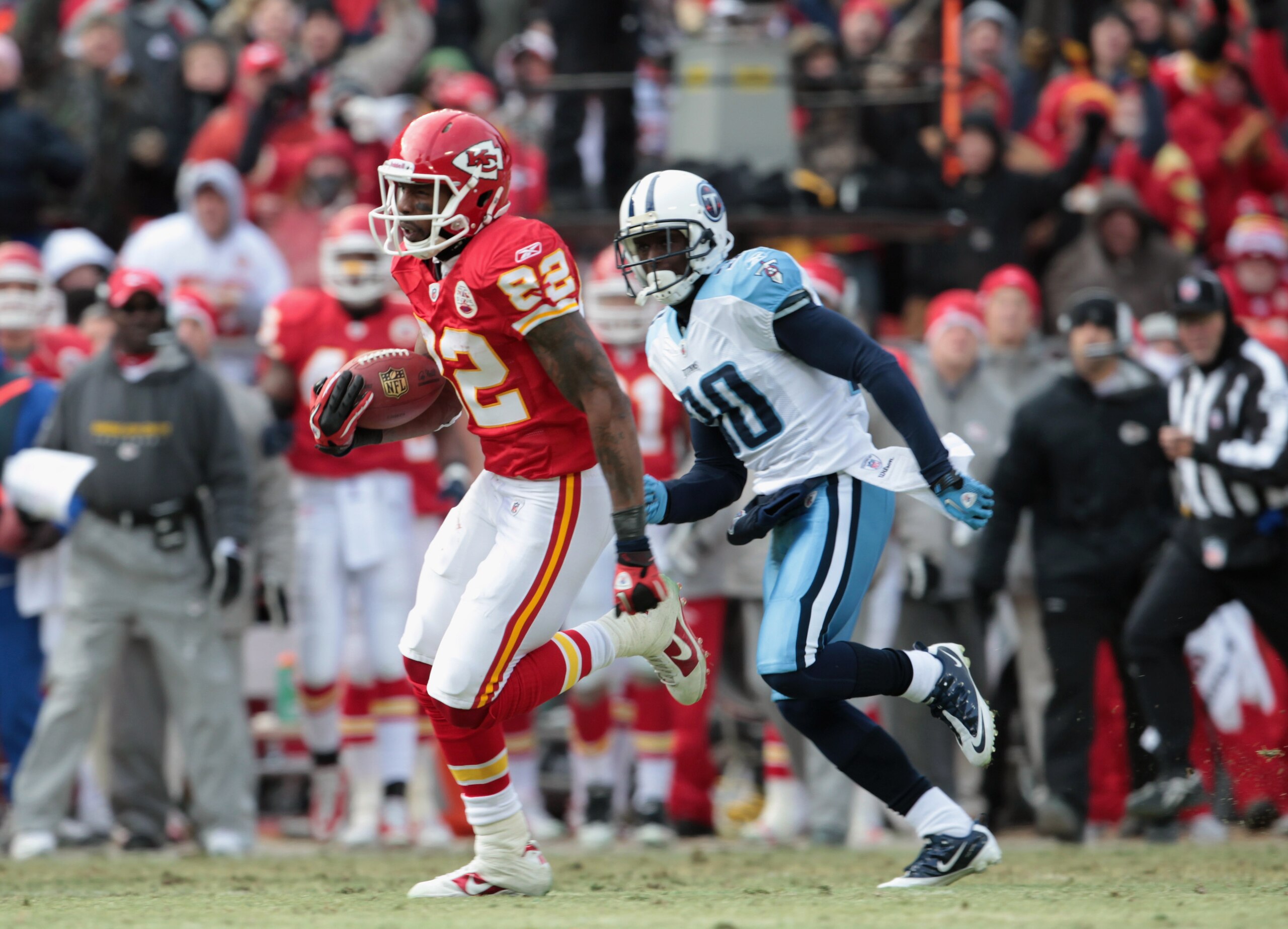 KANSAS CITY, MO - DECEMBER 26: Receiver Dwayne Bowe #82 of the Kansas City Chiefs carries the ball after making a catch on a 75 yard touchdown play during the game against the Tennessee Titans on December 26, 2010 at Arrowhead Stadium in Kansas City, Mis KANSAS CITY, MO - DECEMBER 26: Receiver Dwayne Bowe #82 of the Kansas City Chiefs carries the ball after making a catch on a 75 yard touchdown play during the game against the Tennessee Titans on December 26, 2010 at Arrowhead Stadium in Kansas City, Mis