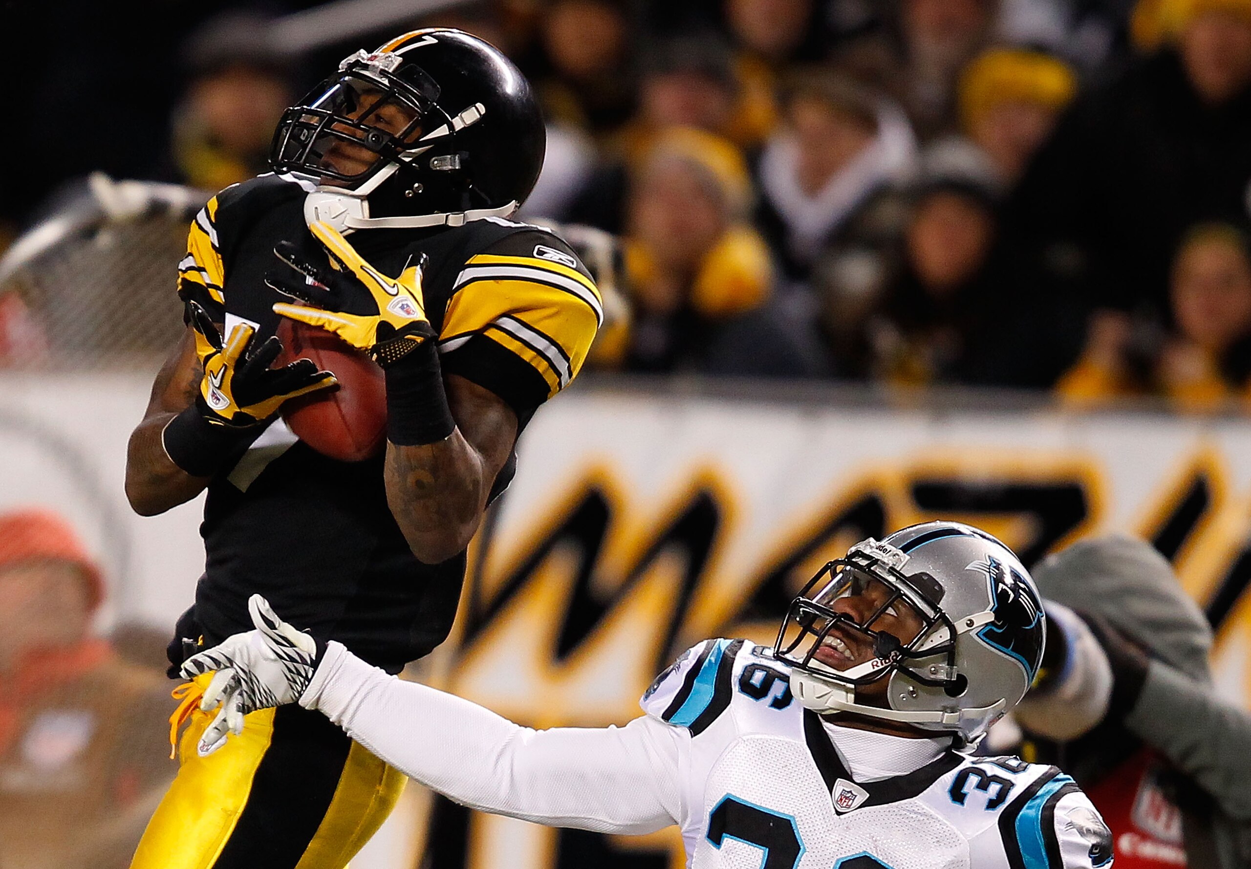 PITTSBURGH - DECEMBER 23: Mike Wallace #17 of the Pittsburgh Steelers catches a pass in front of Robert McClain #36 of the Carolina Panthers during the game on December 23, 2010 at Heinz Field in Pittsburgh, Pennsylvania. (Photo by Jared Wickerham/Getty PITTSBURGH - DECEMBER 23: Mike Wallace #17 of the Pittsburgh Steelers catches a pass in front of Robert McClain #36 of the Carolina Panthers during the game on December 23, 2010 at Heinz Field in Pittsburgh, Pennsylvania. (Photo by Jared Wickerham/Getty
