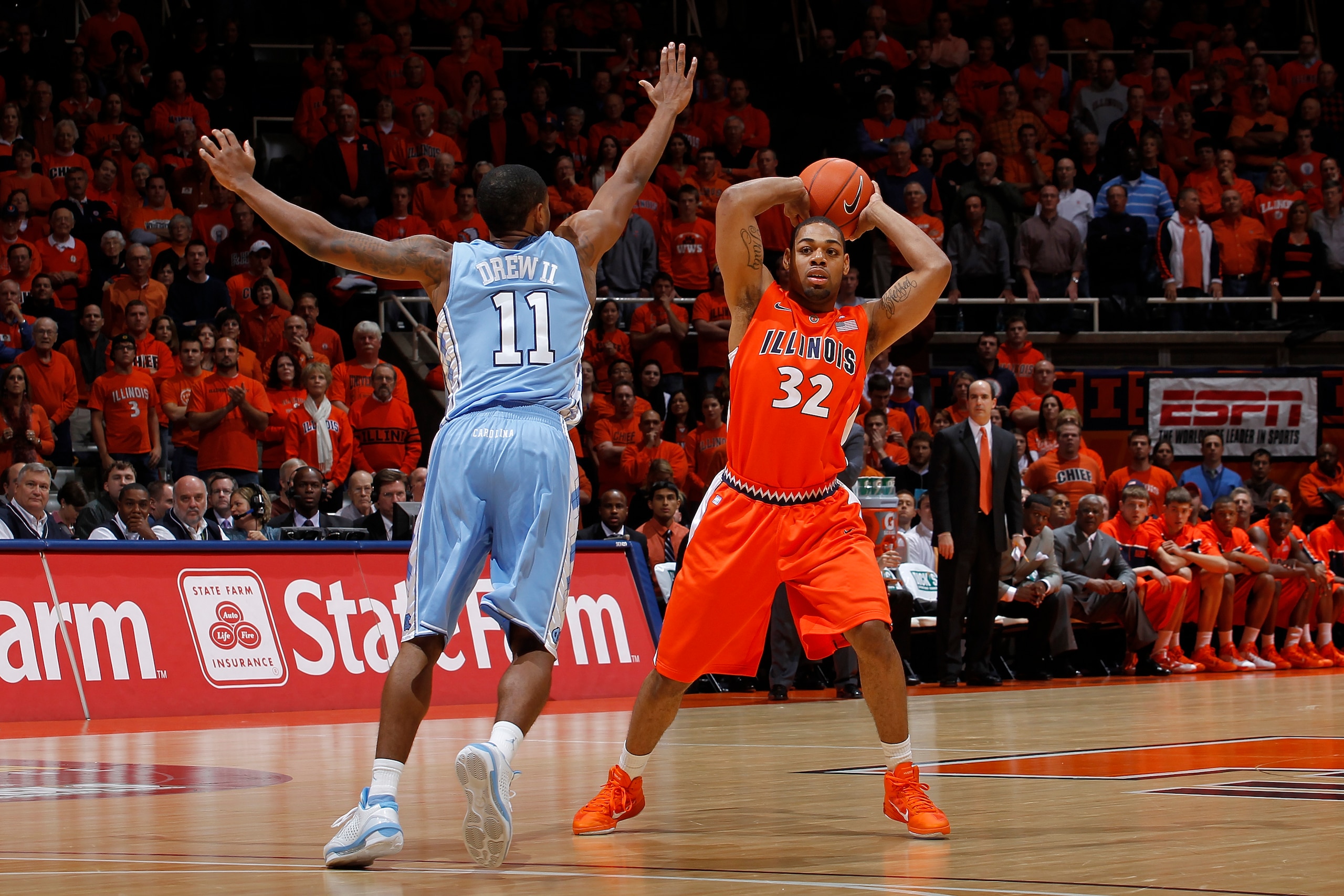 CHAMPAIGN, IL - NOVEMBER 30: Demetri McCamey #32 of the Illinois Fighting Illini looks to pass around Larry Drew II #11 of the North Carolina Tar Heels during first half action of the 2010 ACC/Big Ten Challenge at Assembly Hall on November 30, 2010 in Cha CHAMPAIGN, IL - NOVEMBER 30: Demetri McCamey #32 of the Illinois Fighting Illini looks to pass around Larry Drew II #11 of the North Carolina Tar Heels during first half action of the 2010 ACC/Big Ten Challenge at Assembly Hall on November 30, 2010 in Cha