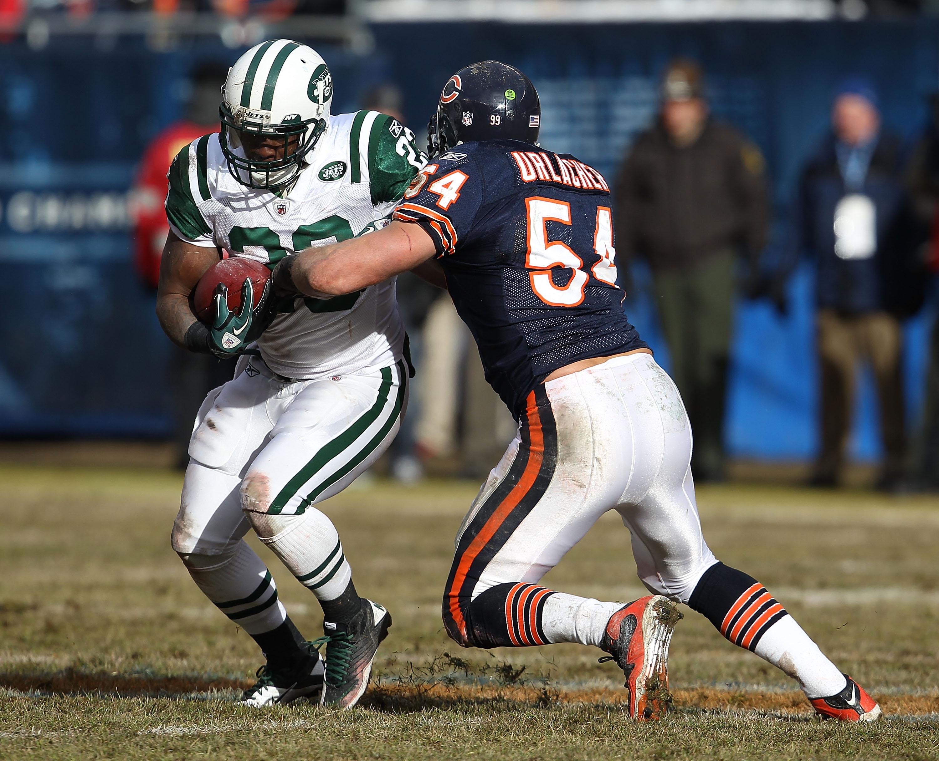 CHICAGO, IL - DECEMBER 26: Brian Urlacher #54 of the Chicago Bears brings down Shonn Greene #23 the New York Jets at Soldier Field on December 26, 2010 in Chicago, Illinois. The Bears defeated the Jets 38-34. (Photo by Jonathan Daniel/Getty Images)