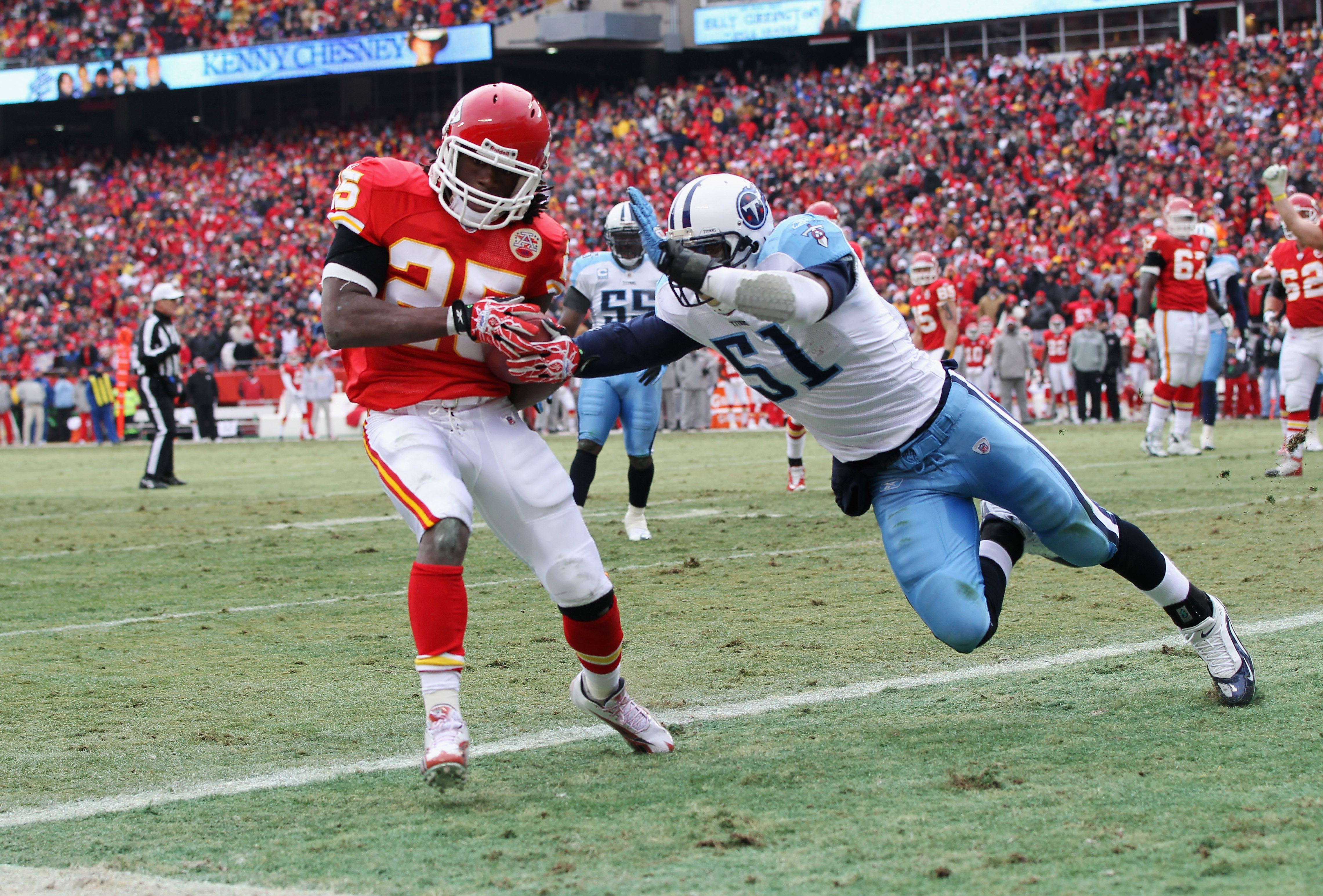 KANSAS CITY, MO - DECEMBER 26:  Jamaal Charles #25 of the Kansas City Chiefs makes a catch in the endzone for a touchdown as Gerald McRath #51 of the Tennessee Titans defends during the game on December 26, 2010 at Arrowhead Stadium in Kansas City, Missou