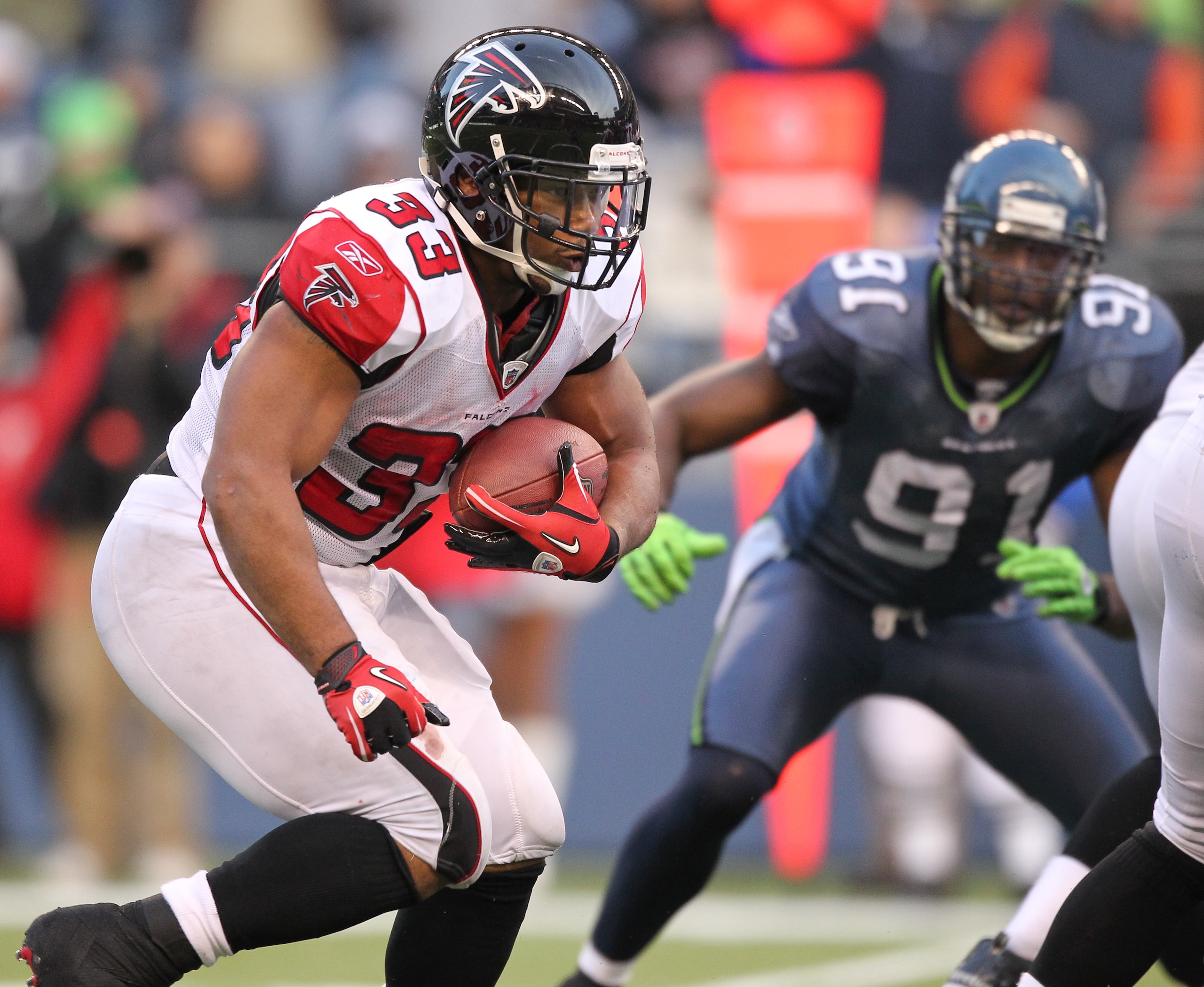 SEATTLE, WA - DECEMBER 19:  Running back Michael Turner #33 of the Atlanta Falcons rushes against the Seattle Seahawks at Qwest Field on December 19, 2010 in Seattle, Washington. (Photo by Otto Greule Jr/Getty Images)