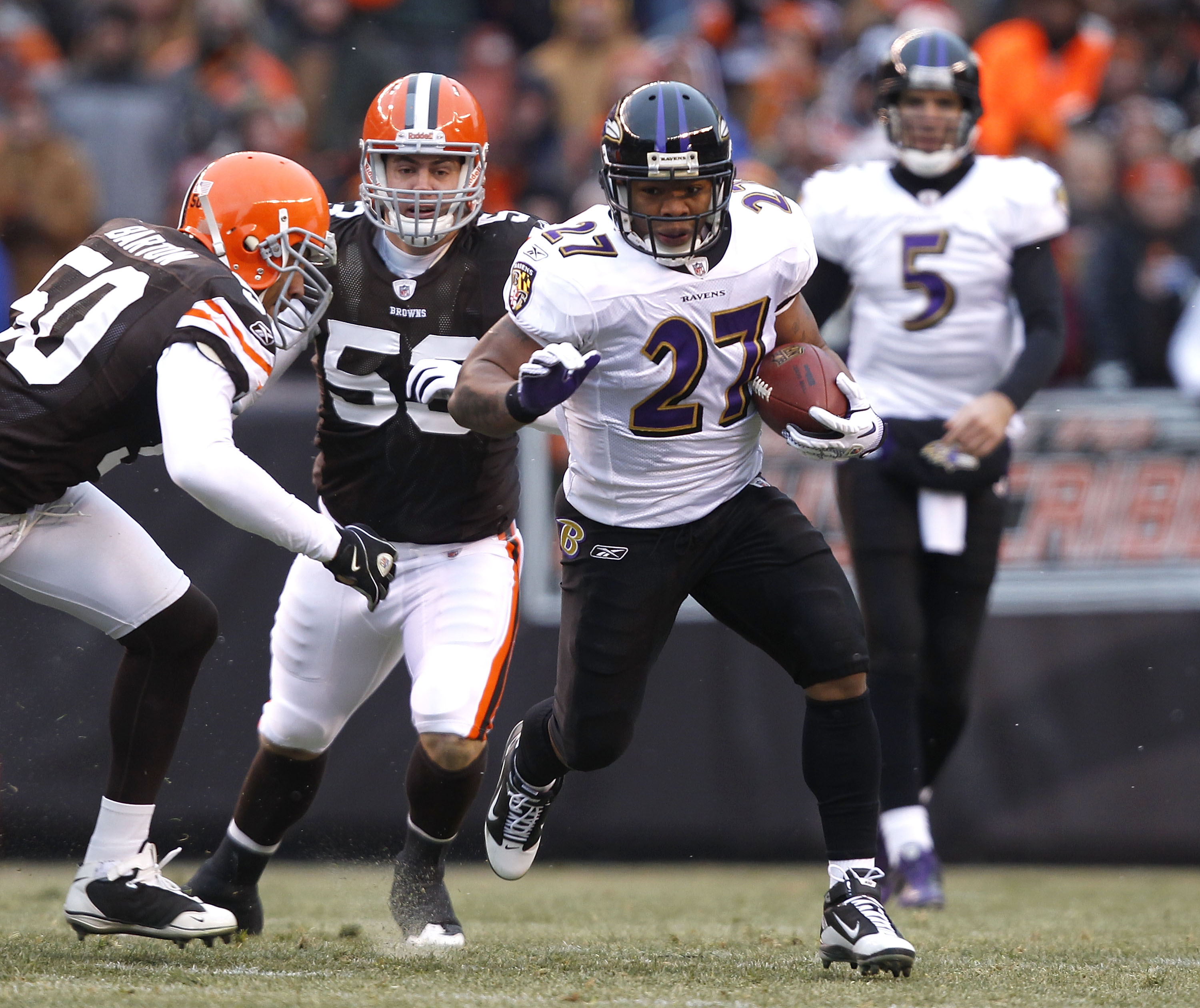 CLEVELAND - DECEMBER 26:  Running back Ray Rice #27 of the Baltimore Ravens runs by linebackers Eric Barton #50 and Matt Roth #53 of the Cleveland Browns at Cleveland Browns Stadium on December 26, 2010 in Cleveland, Ohio.  (Photo by Matt Sullivan/Getty I