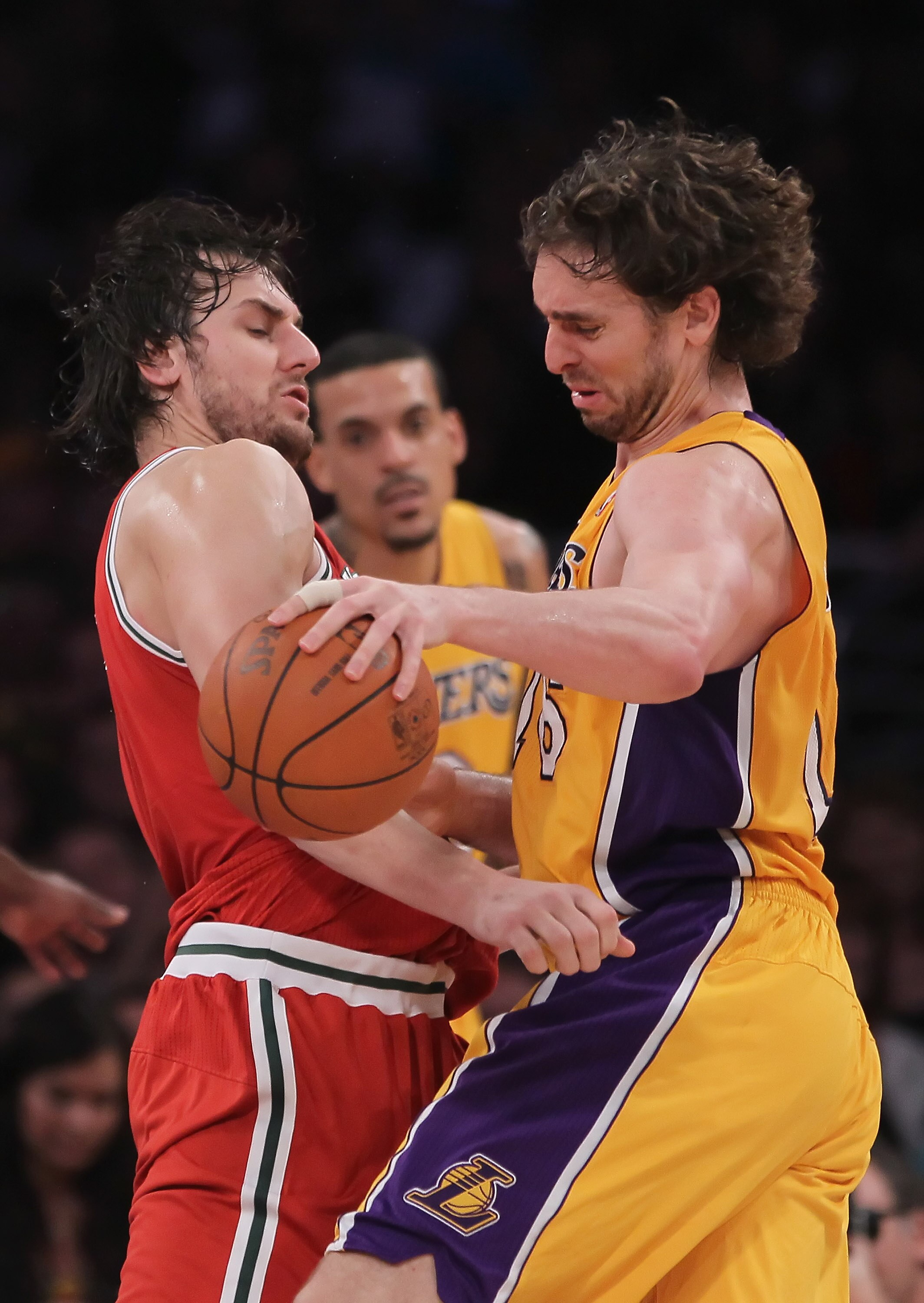 LOS ANGELES, CA - DECEMBER 21:  Pau Gasol #16 of the Los Angeles Lakers is defended by Andrew Bogut #6 of the Milwaukee Bucks during the second half at Staples Center on December 21, 2010 in Los Angeles, California. The Bucks defeated the Lakers 98-79. NO