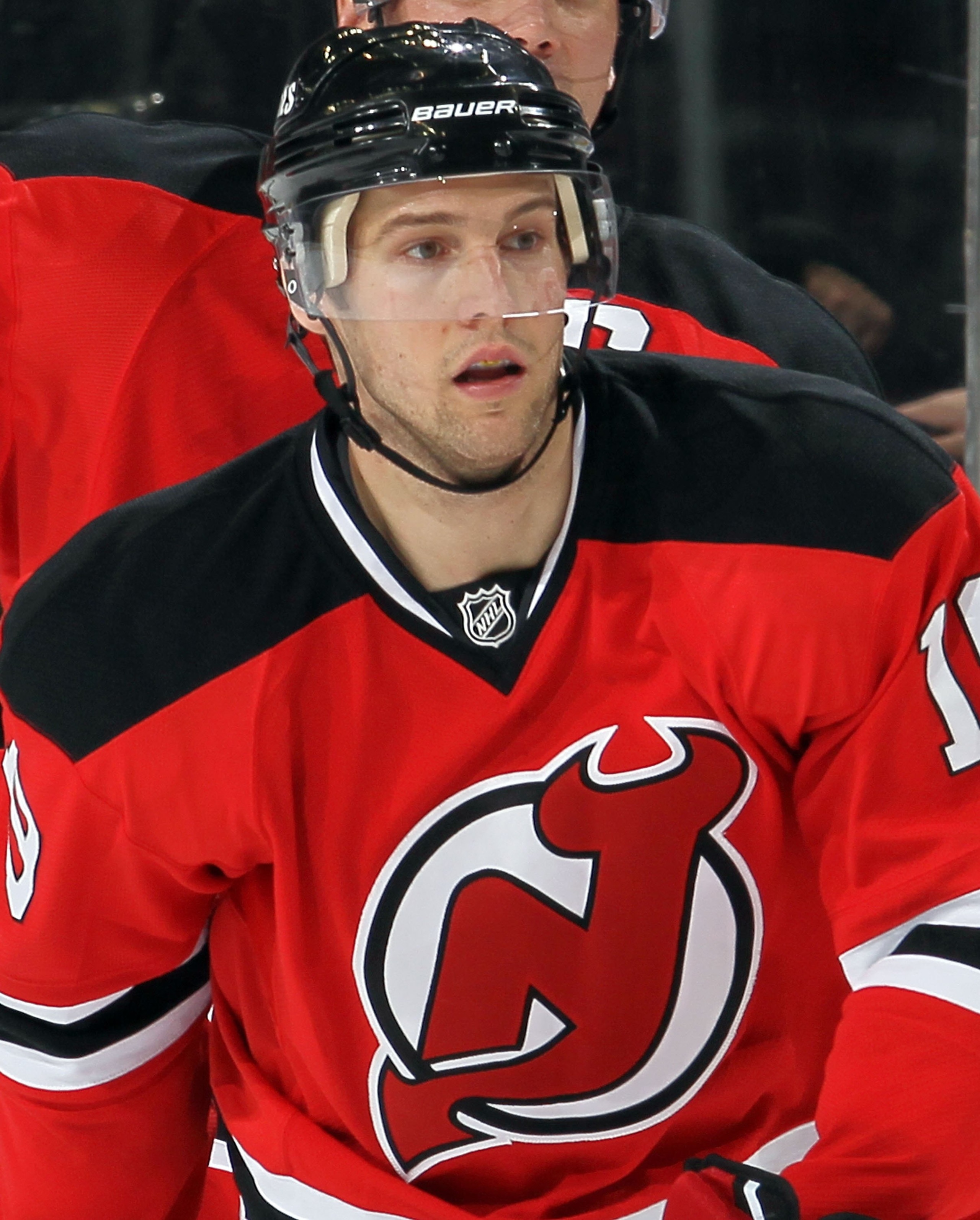 NEWARK, NJ - DECEMBER 23:  Travis Zajac #19 of the New Jersey Devils skates against the New York Islanders at the Prudential Center on December 23, 2010 in Newark, New Jersey. The Isles defeated the Devils 5-1.  (Photo by Jim McIsaac/Getty Images)