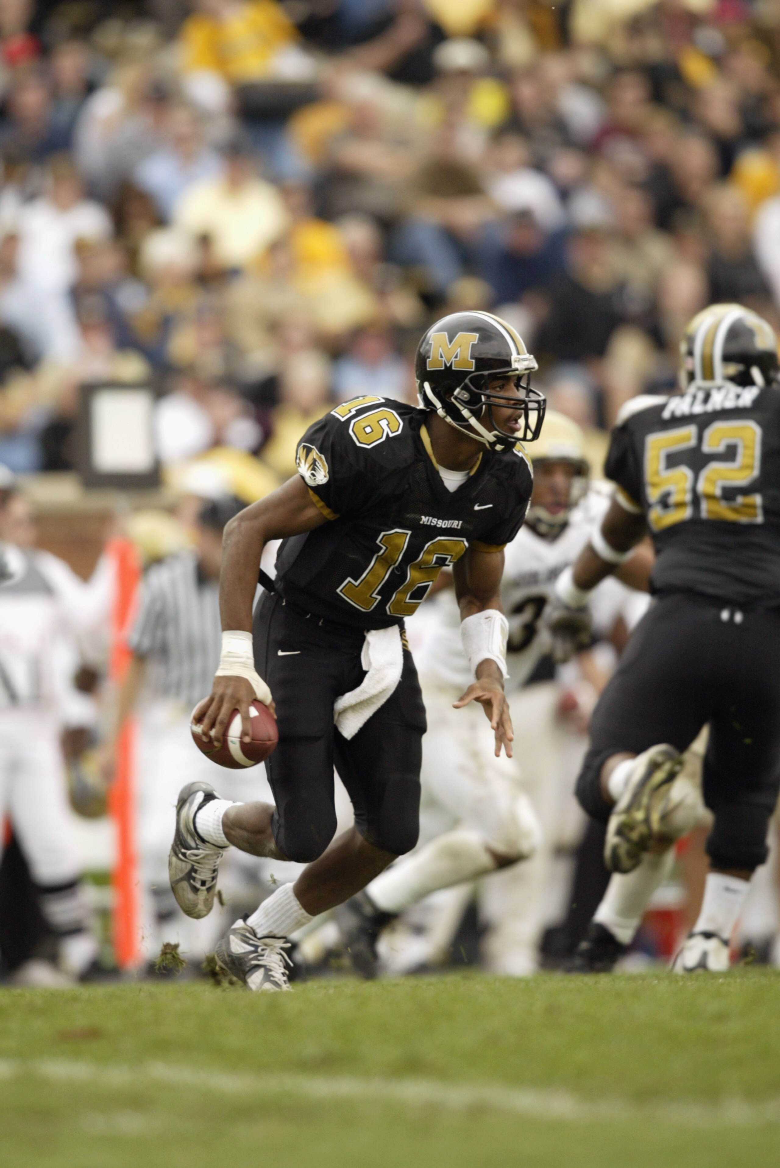 COLUMBIA, MISSOURI-NOVEMBER 9: Quarterback Brad Smith #16 of the Missouri Tigers scrambles with the ball during the game against the Colorado Buffalos on November 9,2002 at Faurot Field in Columbia, Missouri. Colorado won 42-35 in overtime.(Photo by Elsa COLUMBIA, MISSOURI-NOVEMBER 9: Quarterback Brad Smith #16 of the Missouri Tigers scrambles with the ball during the game against the Colorado Buffalos on November 9,2002 at Faurot Field in Columbia, Missouri. Colorado won 42-35 in overtime.(Photo by Elsa