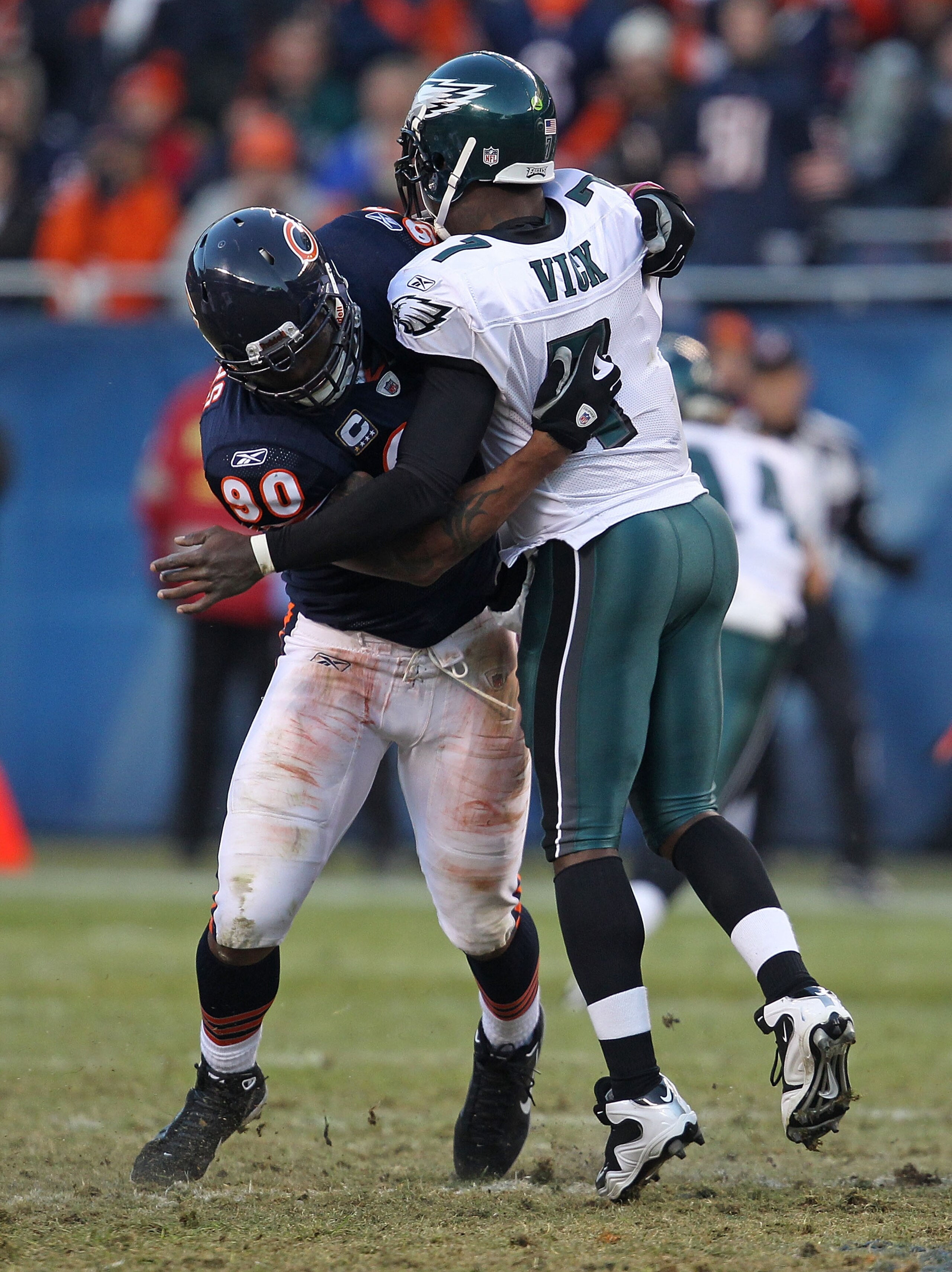 CHICAGO - NOVEMBER 28: Julius Peppers #90 of the Chicago Bears hits Michael Vick #7 of the Philadelphia Eagles at Soldier Field on November 28, 2010 in Chicago, Illinois. The Bears defeated the Eagles 31-26. (Photo by Jonathan Daniel/Getty Images)