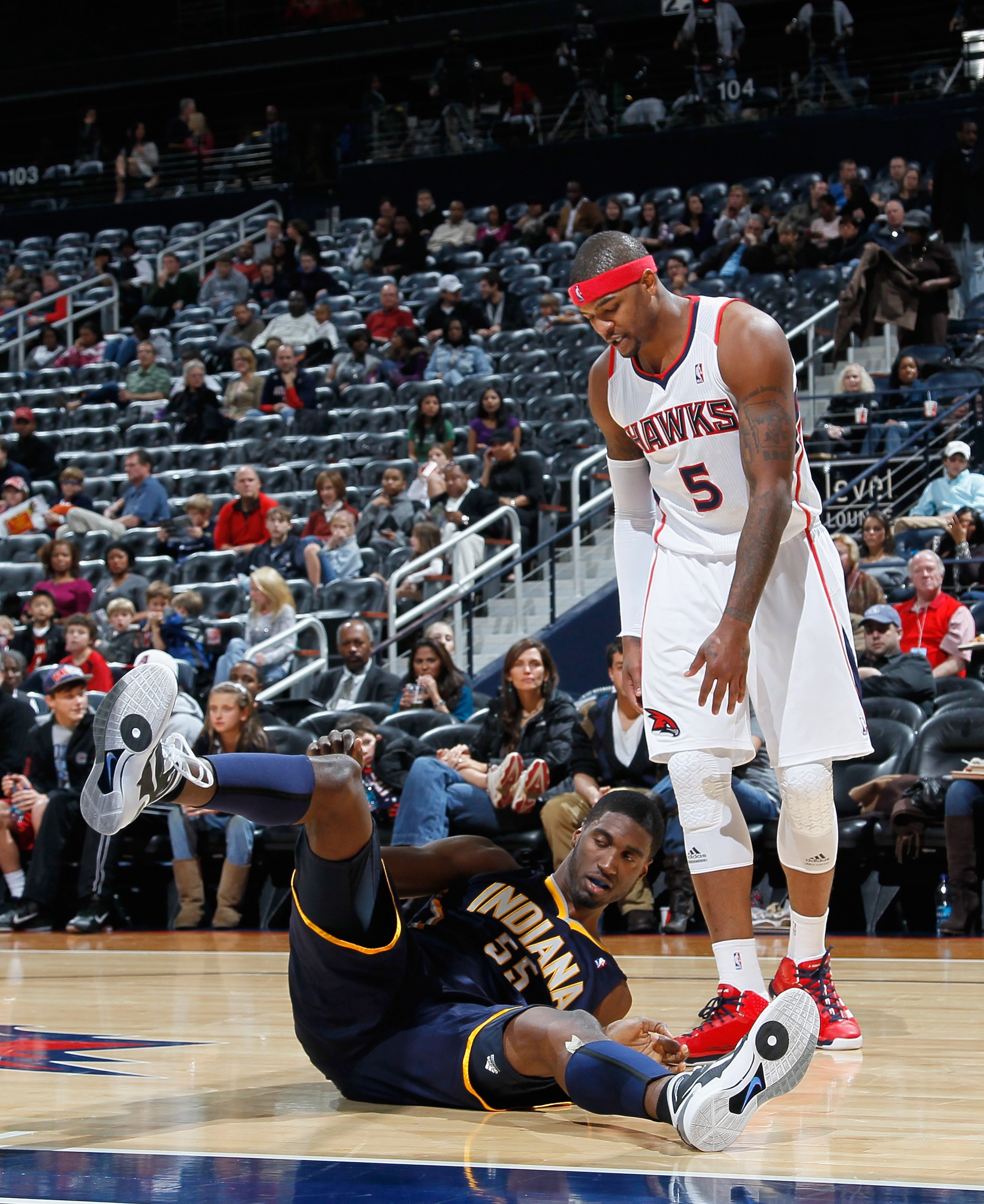 ATLANTA, GA - DECEMBER 11: Josh Smith #5 of the Atlanta Hawks stands over Roy Hibbert #55 of the Indiana Pacers after fouling him at Philips Arena on December 11, 2010 in Atlanta, Georgia. NOTE TO USER: User expressly acknowledges and agrees that, by do ATLANTA, GA - DECEMBER 11: Josh Smith #5 of the Atlanta Hawks stands over Roy Hibbert #55 of the Indiana Pacers after fouling him at Philips Arena on December 11, 2010 in Atlanta, Georgia. NOTE TO USER: User expressly acknowledges and agrees that, by do
