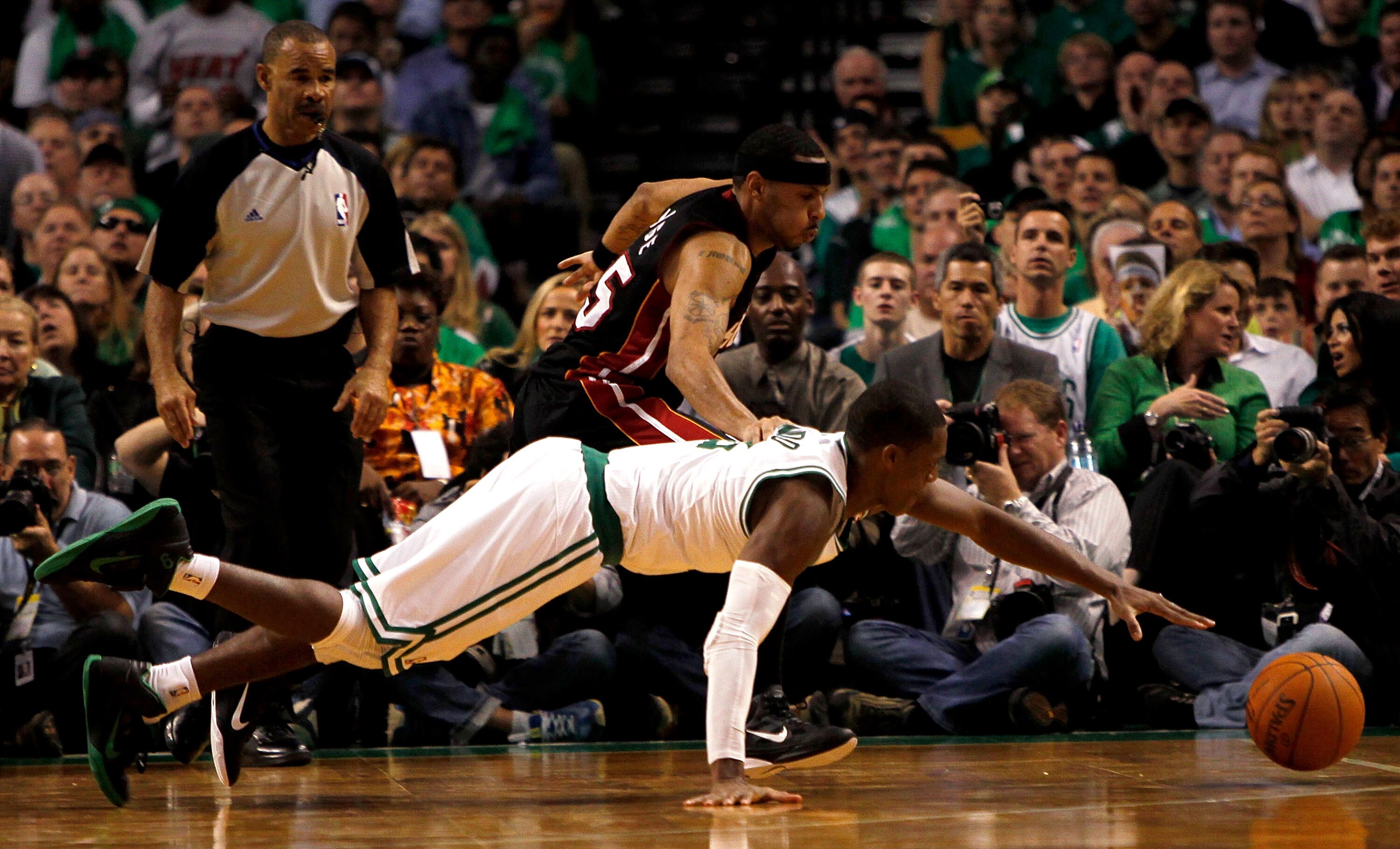 BOSTON, MA - OCTOBER 26: Eddie House #55 of the Miami Heat battles Rajon Rondo #9 of the Boston Celtics for a loose ball at the TD Banknorth Garden on October 26, 2010 in Boston, Massachusetts. NOTE TO USER: User expressly acknowledges and agrees that, by