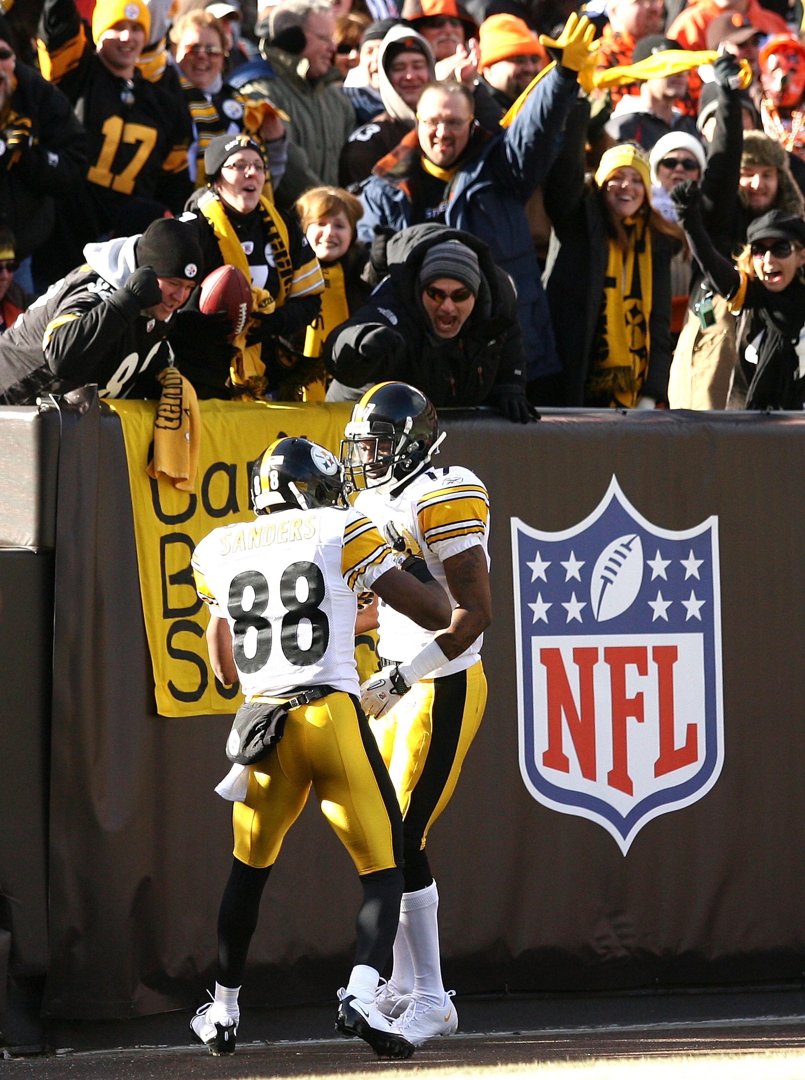 CLEVELAND, OH - JANUARY 02:  Wide receiver Mike Wallace #17 of the Pittsburgh Steelers celebrates after scoring a touchdown with Emmanuel Sanders #88 against the Cleveland Browns at Cleveland Browns Stadium on January 2, 2011 in Cleveland, Ohio.  (Photo b