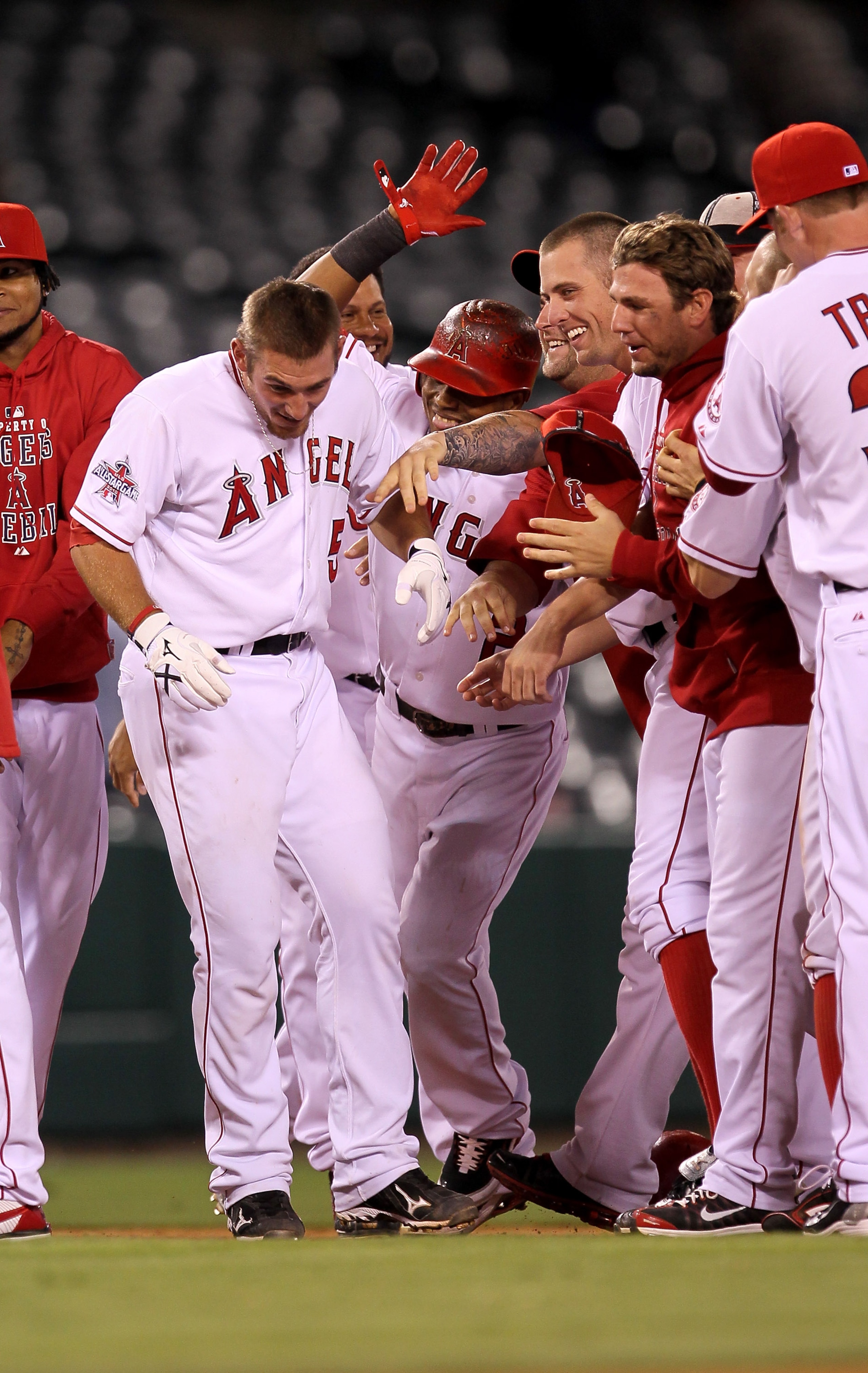 ANAHEIM, CA - SEPTEMBER 08:  Jeff Mathis #5 of the Los Angeles Angels of Anaheim is mobbed by teammates after hitting a  walk off sacrifice fly to score Torri Hunter form third base against the Cleveland Indians in the 16th inning on September 8, 2010 at