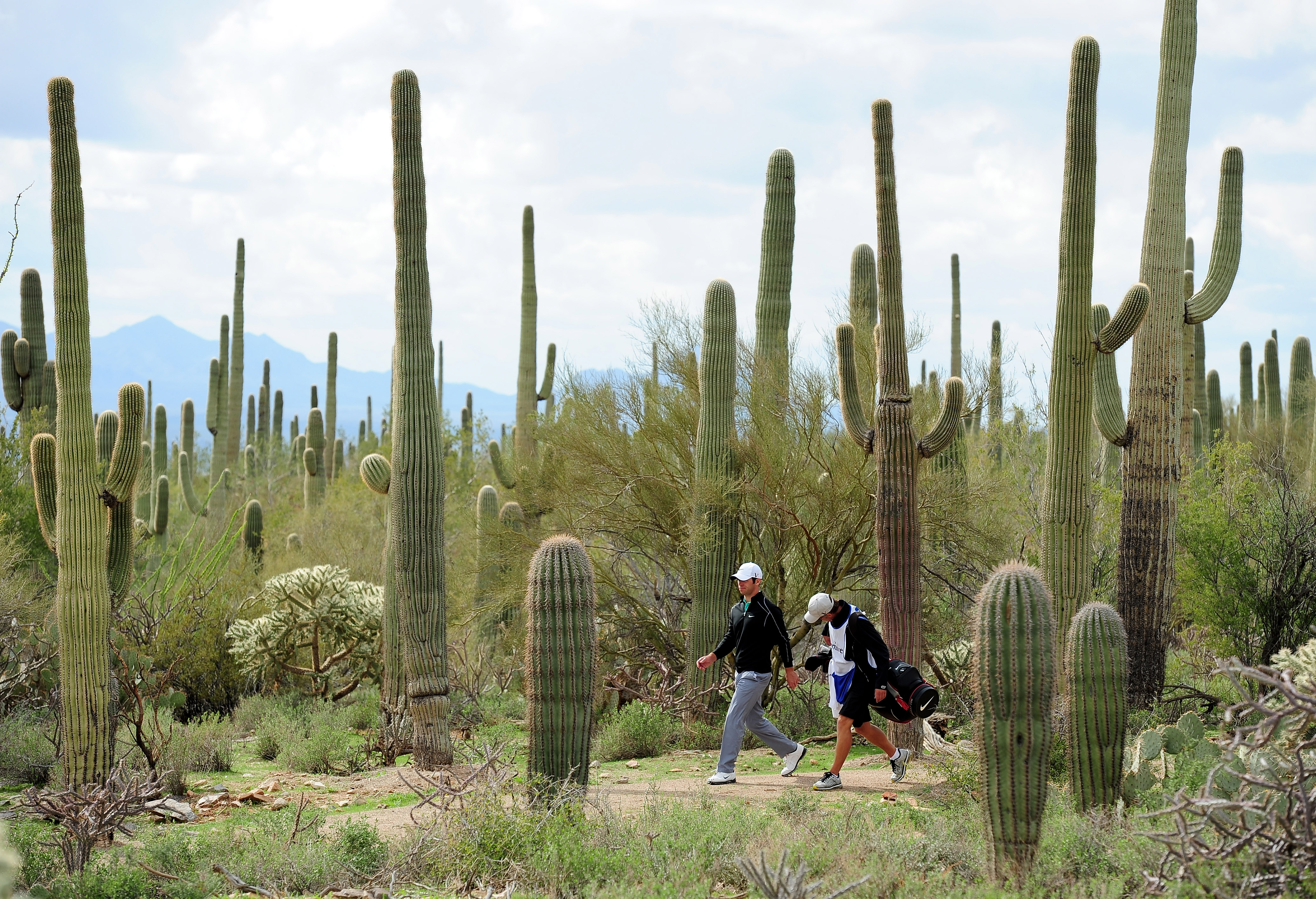 MARANA, AZ - FEBRUARY 21:  Paul Casey of England and caddie Christian Donald walk during final round of the Accenture Match Play Championship at the Ritz-Carlton Golf Club at  on February 21, 2010 in Marana, Arizona.  (Photo by Stuart Franklin/Getty Image
