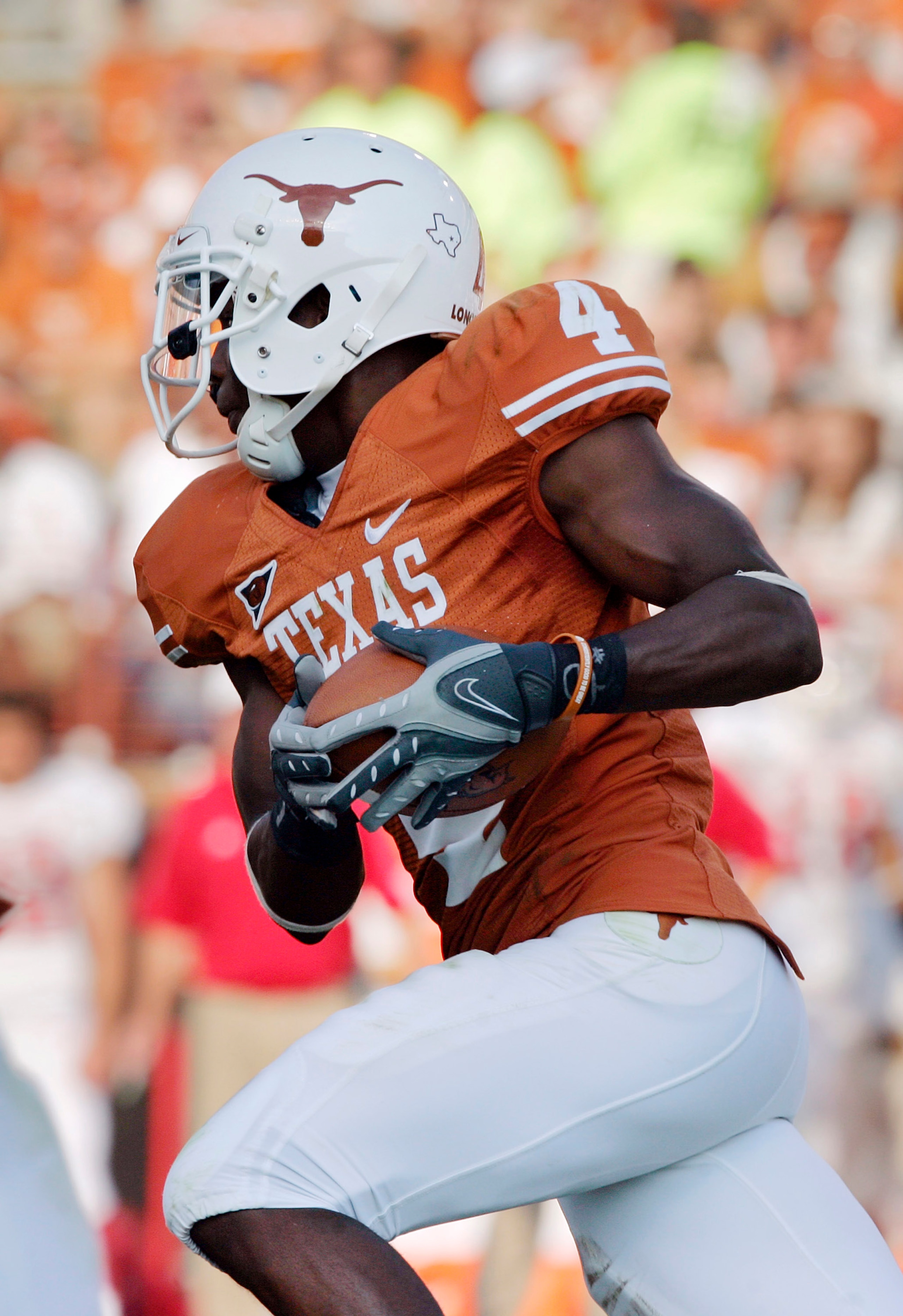 AUSTIN, TX - SEPTEMBER 27:  Defensive back Aaron Williams #4 of the Texas Longhorns runs for a touchdown after grabbing an interception against the Arkansas Razorbacks in the fourth quarter on September 27, 2008 at Darrell K Royal-Texas Memorial Stadium i