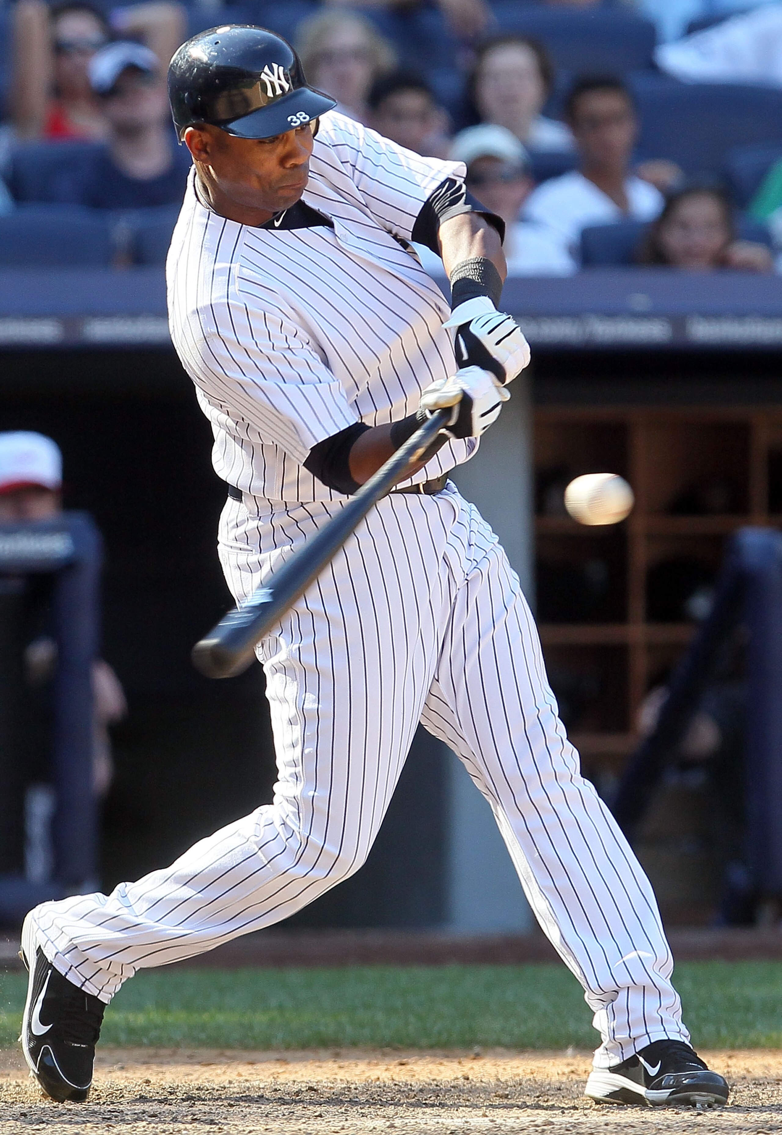 NEW YORK - JULY 04:  Marcus Thames #38 of the New York Yankees connects on a game winning tenth inning RBI single against the Toronto Blue Jays on July 4, 2010 at Yankee Stadium in the Bronx borough of New York City. The Yankees defeated the Jays 7-6 in t