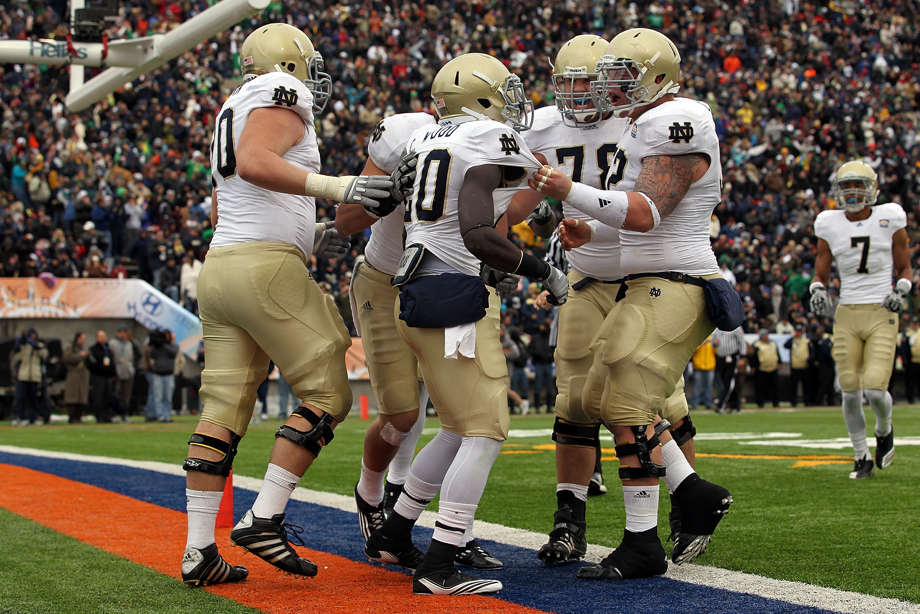 EL PASO, TX - DECEMBER 30:  Running back Cierre Wood #20 of the Notre Dame Fighting Irish celebrates a touchdown against the Miami Hurricanes during the Hyundai Sun Bowl at Sun Bowl on December 30, 2010 in El Paso, Texas.  (Photo by Ronald Martinez/Getty