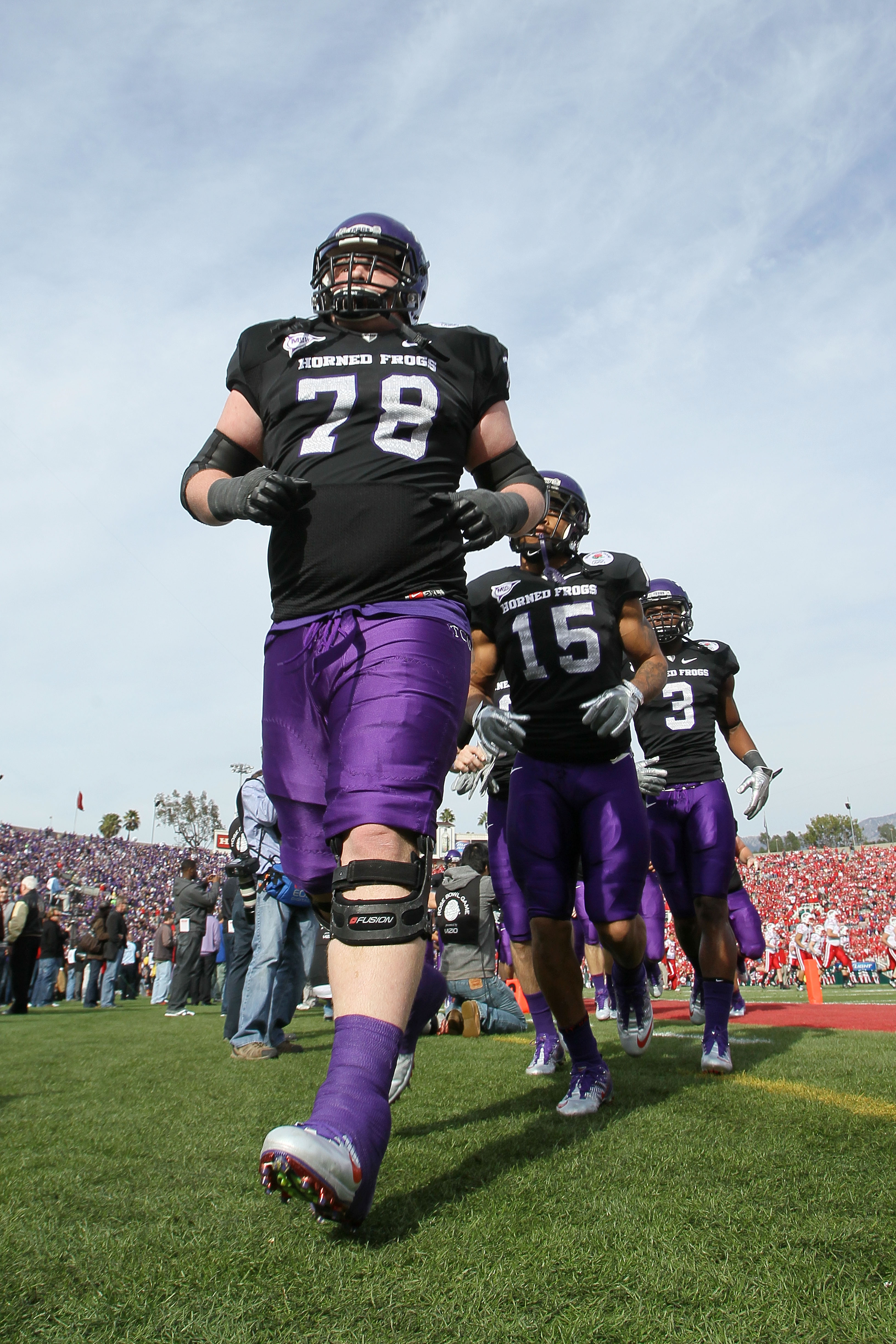 PASADENA, CA - JANUARY 01:  Guard Josh Vernon #78 of the TCU Horned Frogs jogs off the field prior to playing the Wisconsin Badgers in the 97th Rose Bowl game on January 1, 2011 in Pasadena, California.  (Photo by Stephen Dunn/Getty Images)