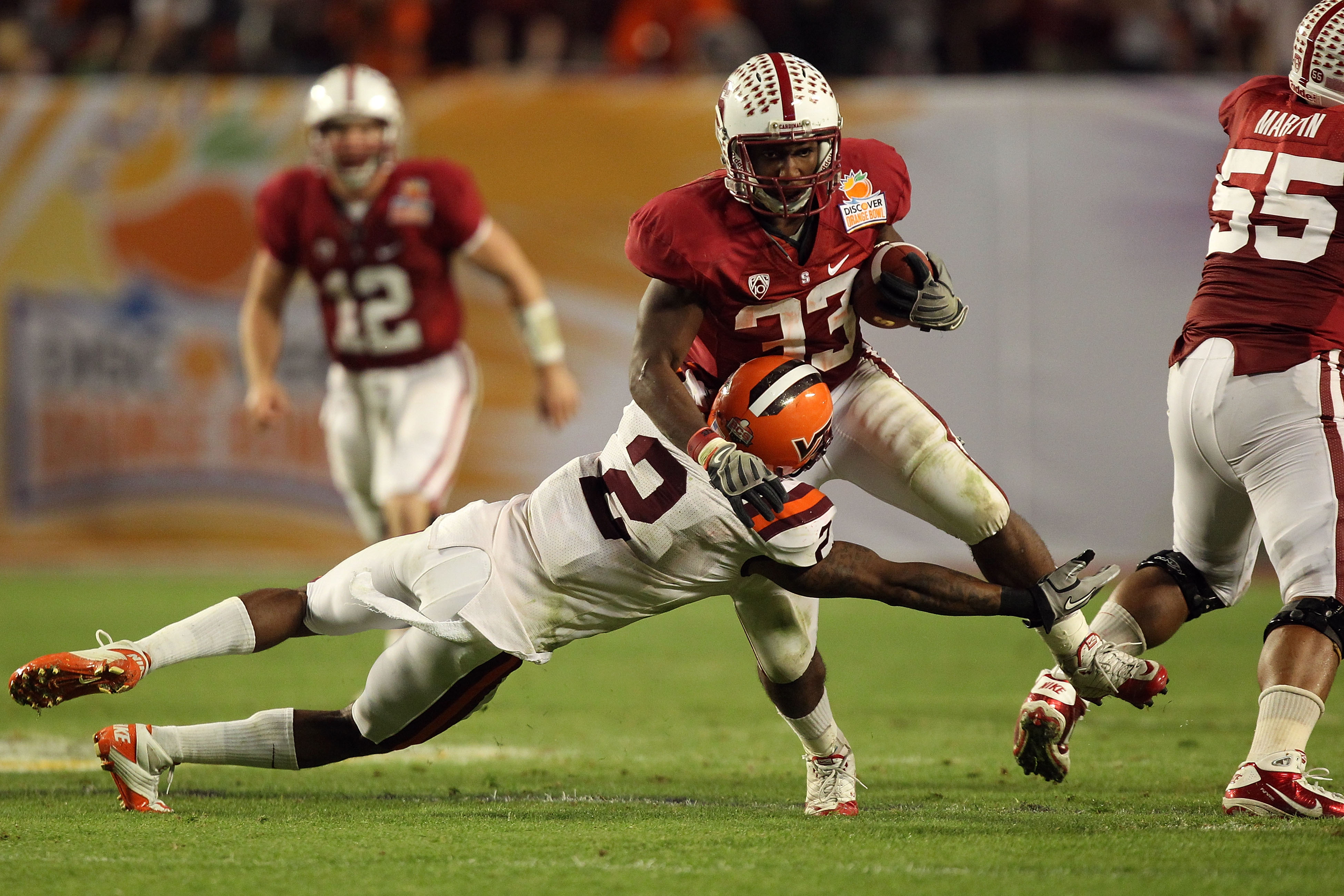 MIAMI, FL - JANUARY 03:  Stepfan Taylor #33 of the Stanford Cardinal runs the ball against Davon Morgan #2 of the Virginai Tech Hokies during the 2011 Discover Orange Bowl at Sun Life Stadium on January 3, 2011 in Miami, Florida.  (Photo by Streeter Lecka