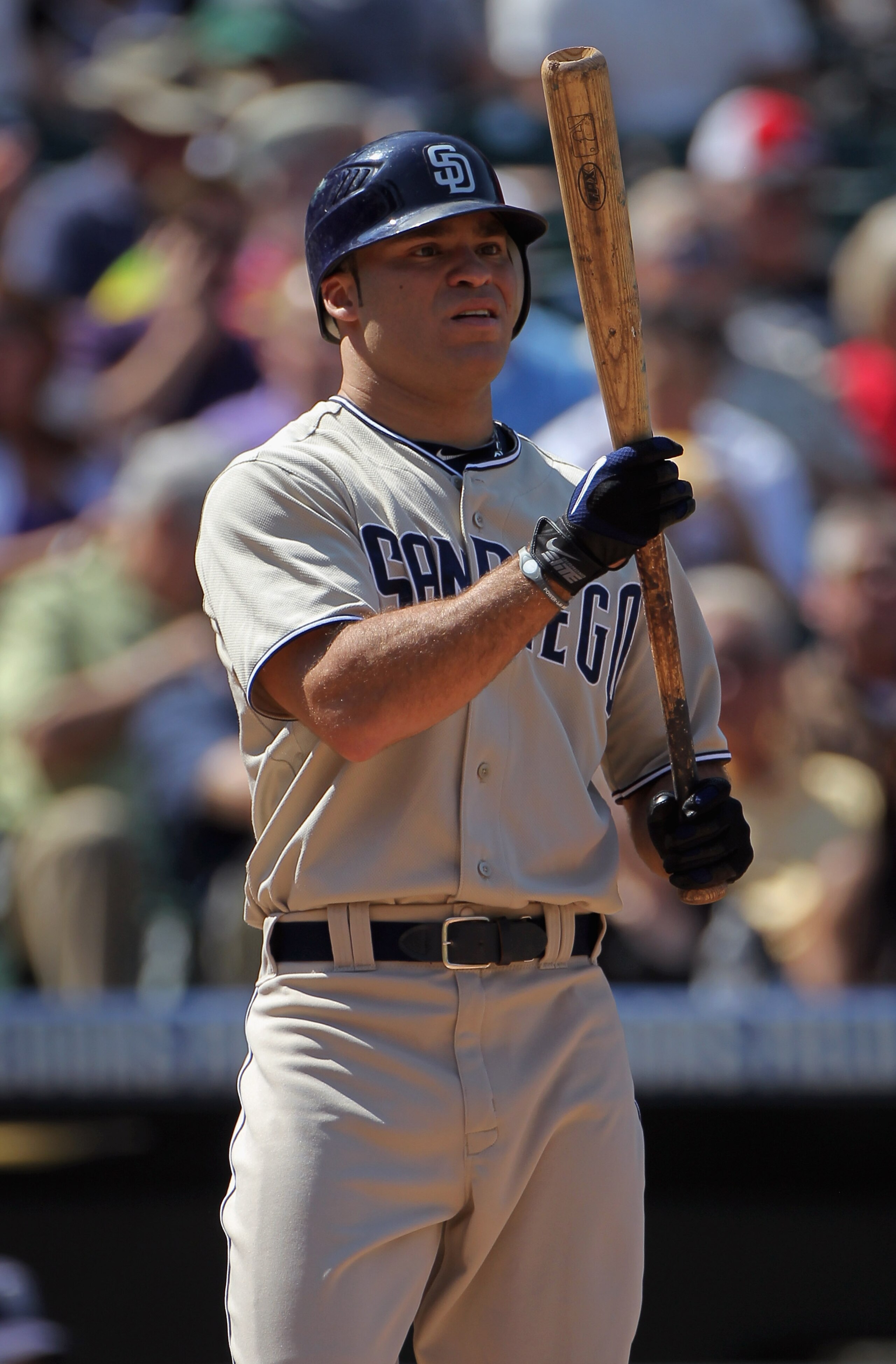 DENVER - SEPTEMBER 15:  Scott Hairston #12 of the San Diego Padres takes an at bat against the Colorado Rockies at Coors Field on September 15, 2010 in Denver, Colorado. The Rockies defeated the Padres 9-6.  (Photo by Doug Pensinger/Getty Images)