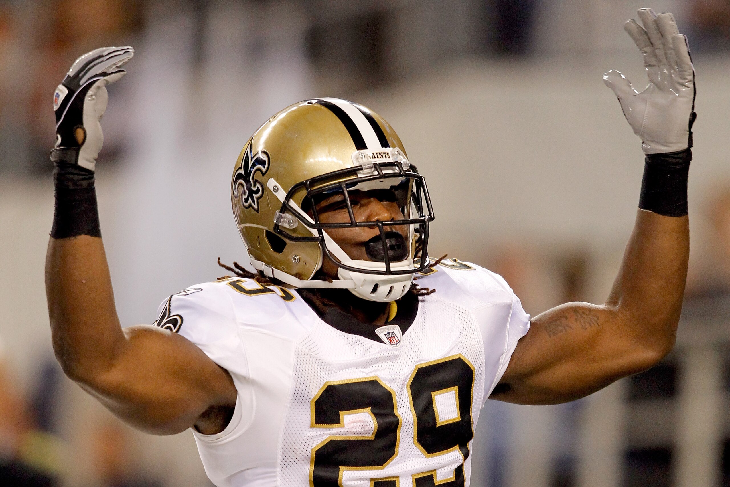 ARLINGTON, TX - NOVEMBER 25: Chris Ivory #29 of the New Orleans Saints celebrates scoring a touchdown against the Dallas Cowboys at Cowboys Stadium on November 25, 2010 in Arlington, Texas.  (Photo by Matthew Stockman/Getty Images)