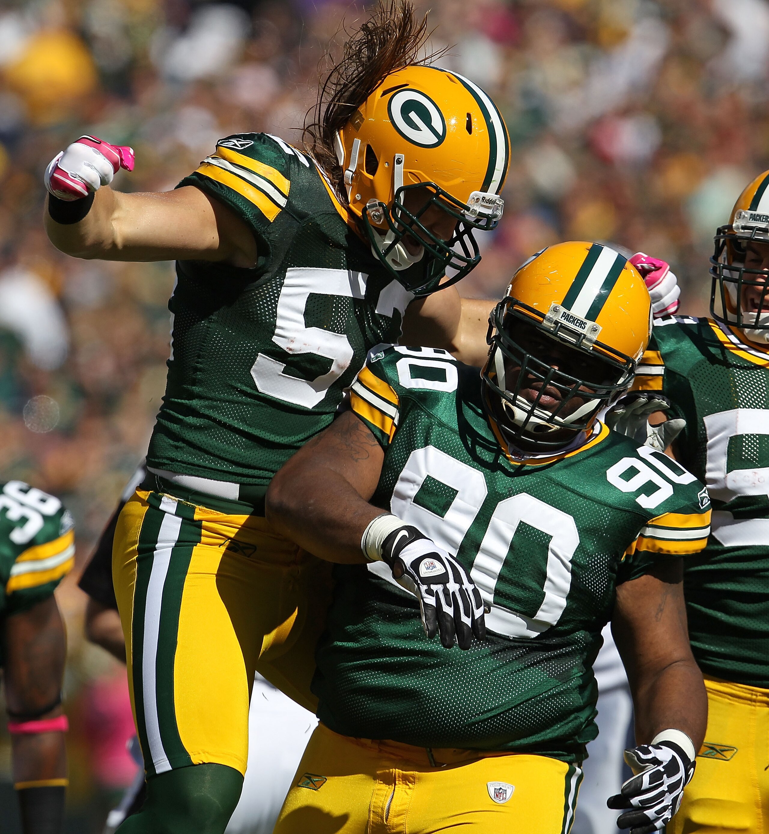 GREEN BAY, WI - OCTOBER 03: Clay Matthews #52 of the Green Bay Packers celebrates a sack by teammate B.J. Raji #90 against the Detroit Lions at Lambeau Field on October 3, 2010 in Green Bay, Wisconsin. The Packers defeated the Lions 28-26. (Photo by Jonat GREEN BAY, WI - OCTOBER 03: Clay Matthews #52 of the Green Bay Packers celebrates a sack by teammate B.J. Raji #90 against the Detroit Lions at Lambeau Field on October 3, 2010 in Green Bay, Wisconsin. The Packers defeated the Lions 28-26. (Photo by Jonat