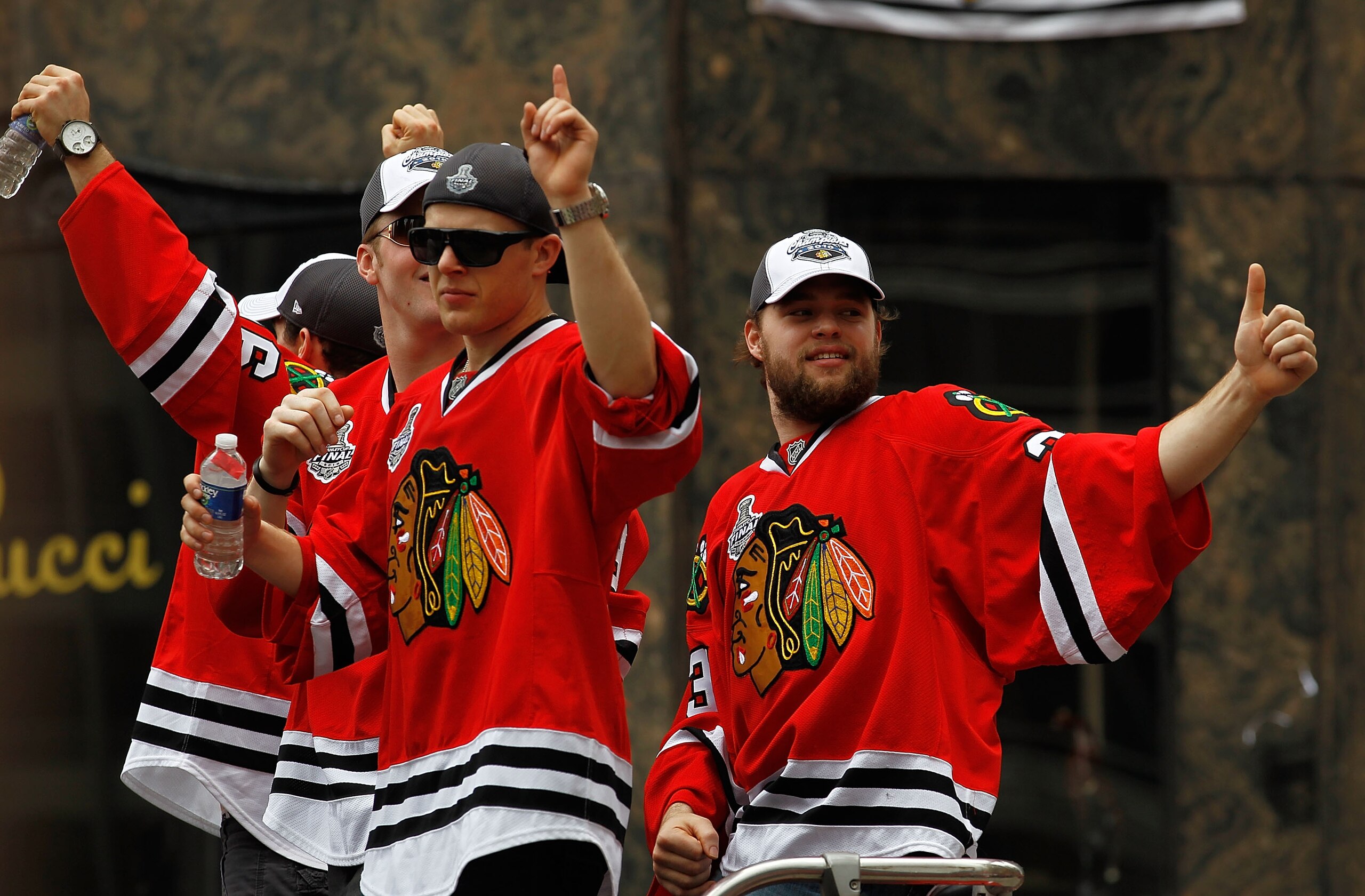 CHICAGO - JUNE 11: (L-R) Jordan Hendry #6, Bryan Bickell #29, Kris Versteeg #32 and Antti Niemi #31 wave to the crowd during the Chicago Blackhawks Stanley Cup victory parade and rally on June 11, 2010 in Chicago, Illinois. (Photo by Jonathan Daniel/Getty