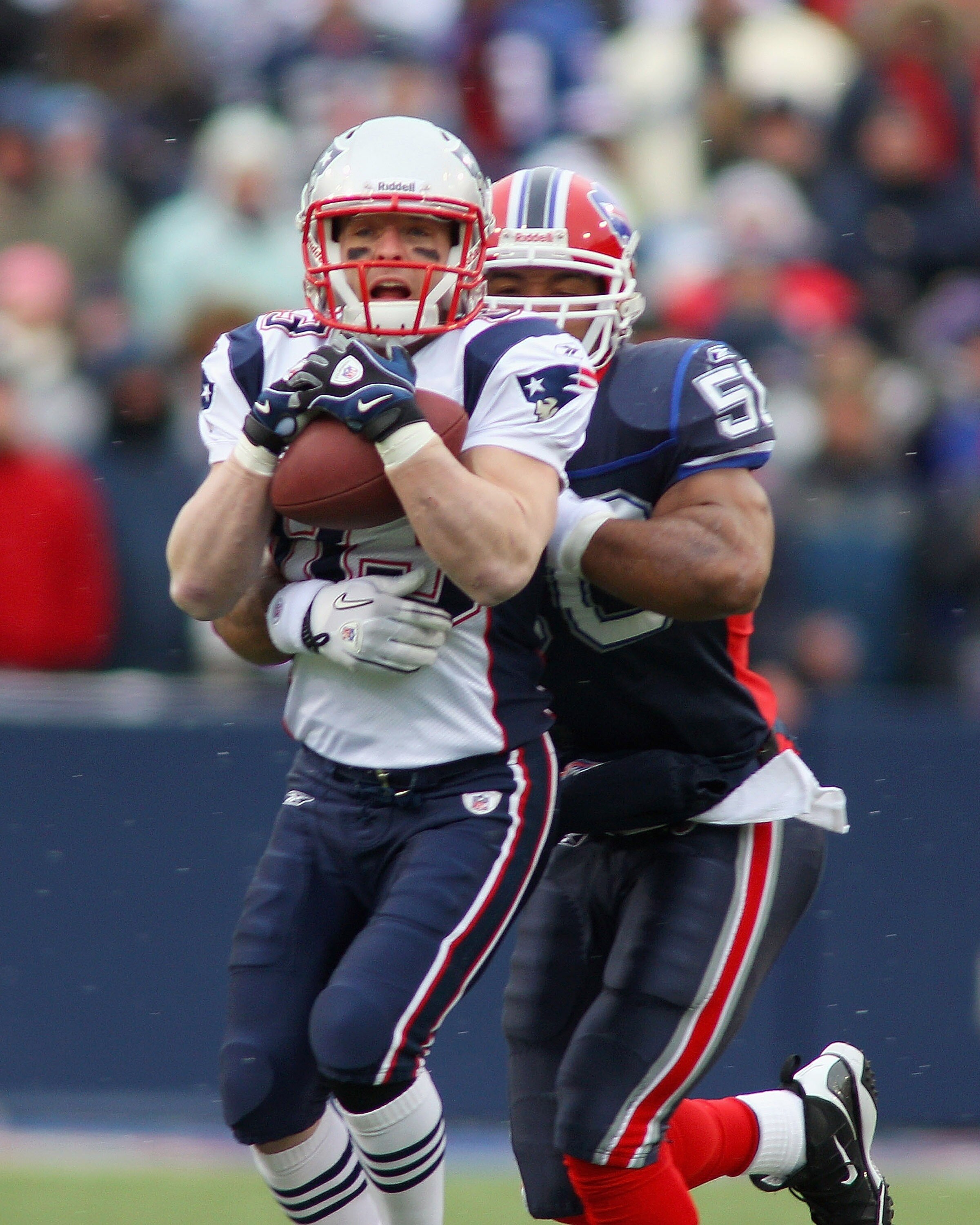 ORCHARD PARK, NY - DECEMBER 26:  Wes Welker #83 of the New England Patriots makes a catch against Akin Ayodele #50 of the Buffalo Bills at Ralph Wilson Stadium on December 26, 2010 in Orchard Park, New York.  (Photo by Rick Stewart/Getty Images)