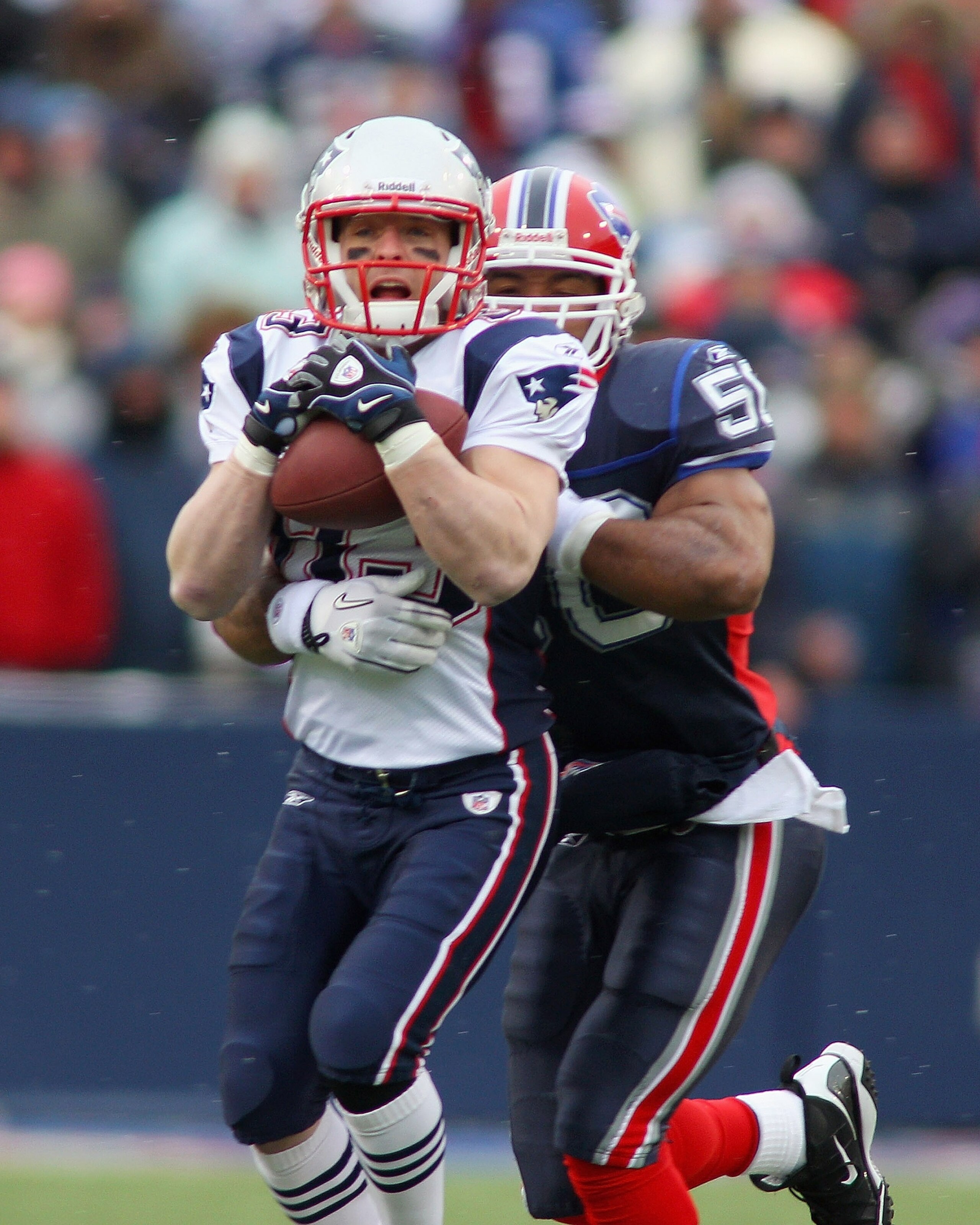 ORCHARD PARK, NY - DECEMBER 26:  Wes Welker #83 of the New England Patriots makes a catch against Akin Ayodele #50 of the Buffalo Bills at Ralph Wilson Stadium on December 26, 2010 in Orchard Park, New York.  (Photo by Rick Stewart/Getty Images)