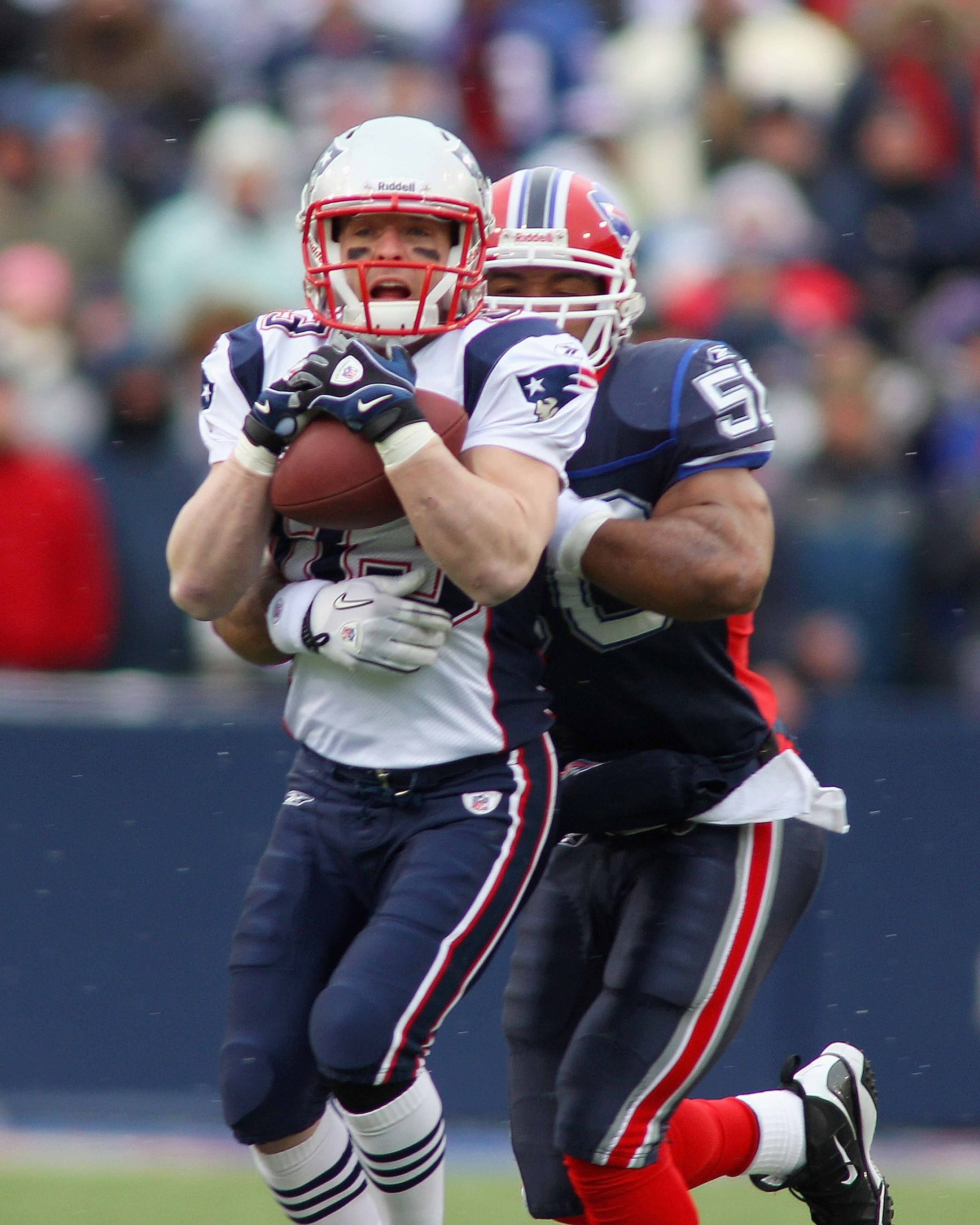 ORCHARD PARK, NY - DECEMBER 26:  Wes Welker #83 of the New England Patriots makes a catch against Akin Ayodele #50 of the Buffalo Bills at Ralph Wilson Stadium on December 26, 2010 in Orchard Park, New York.  (Photo by Rick Stewart/Getty Images)