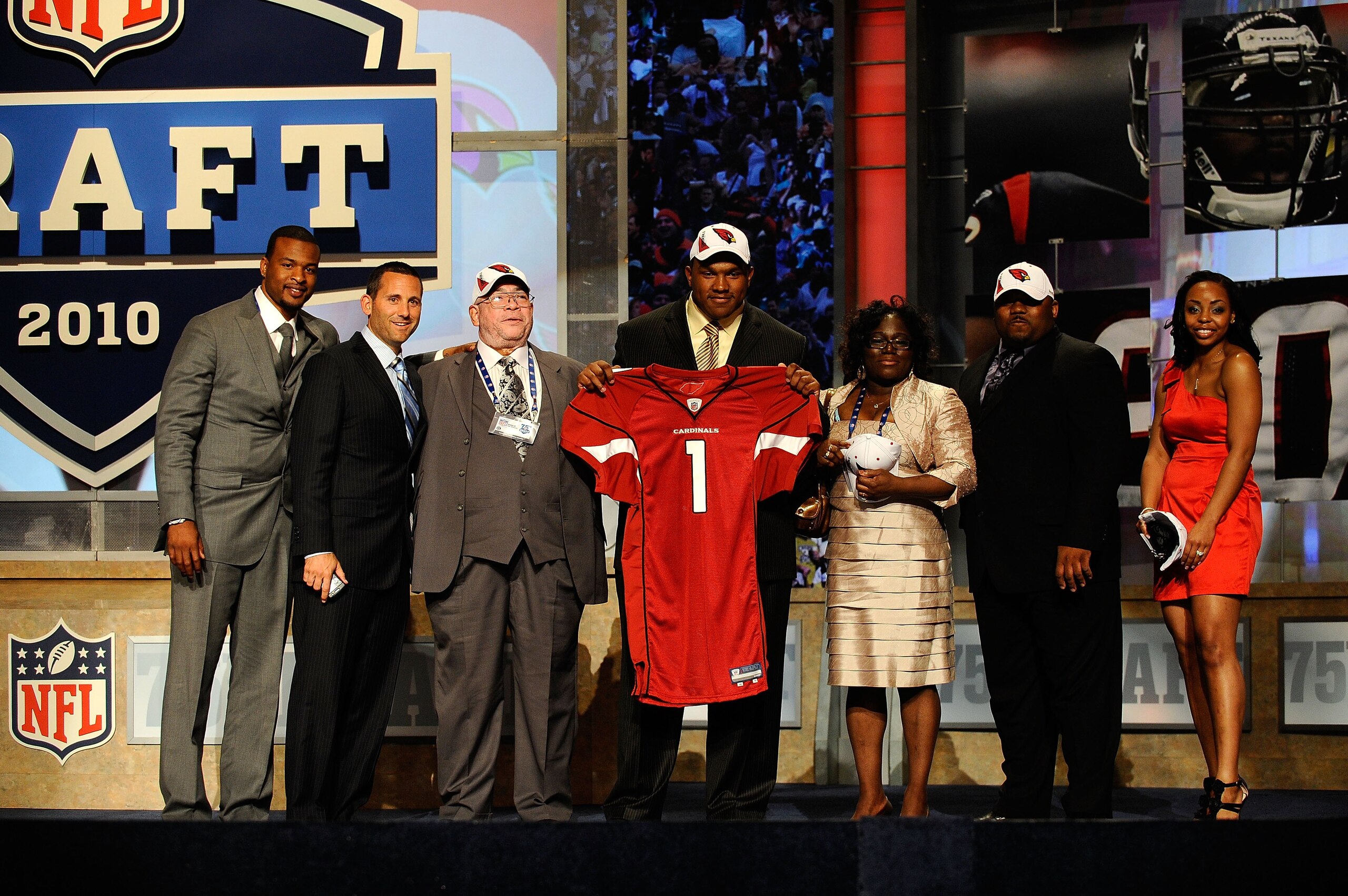 NEW YORK - APRIL 22:  Dan Williams from the Tennessee Volunteers holds up a Arizona Cardinals jersey as he poses with friends and family after he was selected number 26 overall by the Cardinals during the first round of the 2010 NFL Draft at Radio City Mu