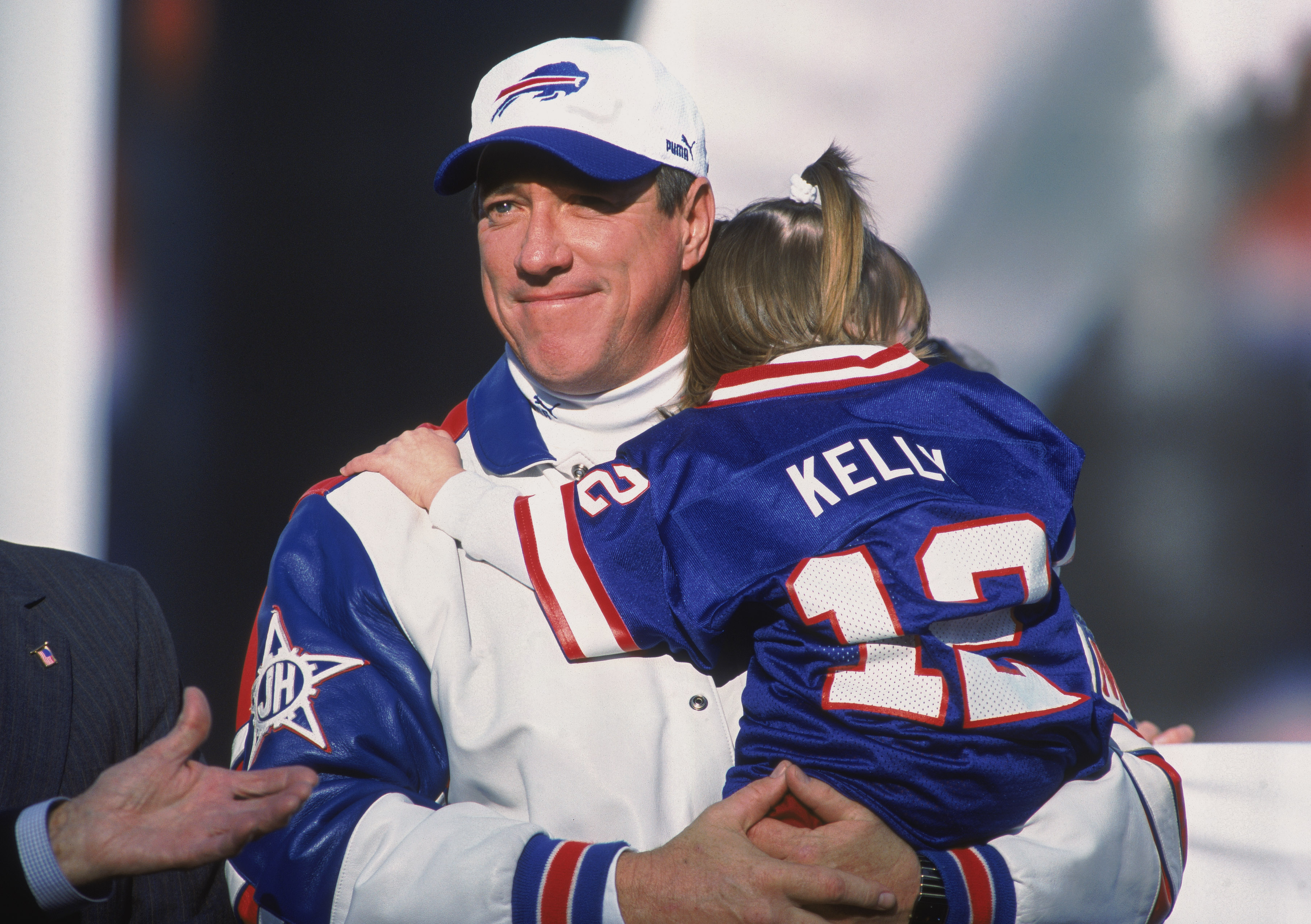 18 Nov 2001:  Quarterback Jim Kelly #12 of the Buffalo Bills holding his daughter during Jim Kelly's Retirement Ceremony before the game against the Seattle Seahawks at the Ralph Wilson Stadium in Orchard Park, New York. The Seahawks defeated the Bills 23