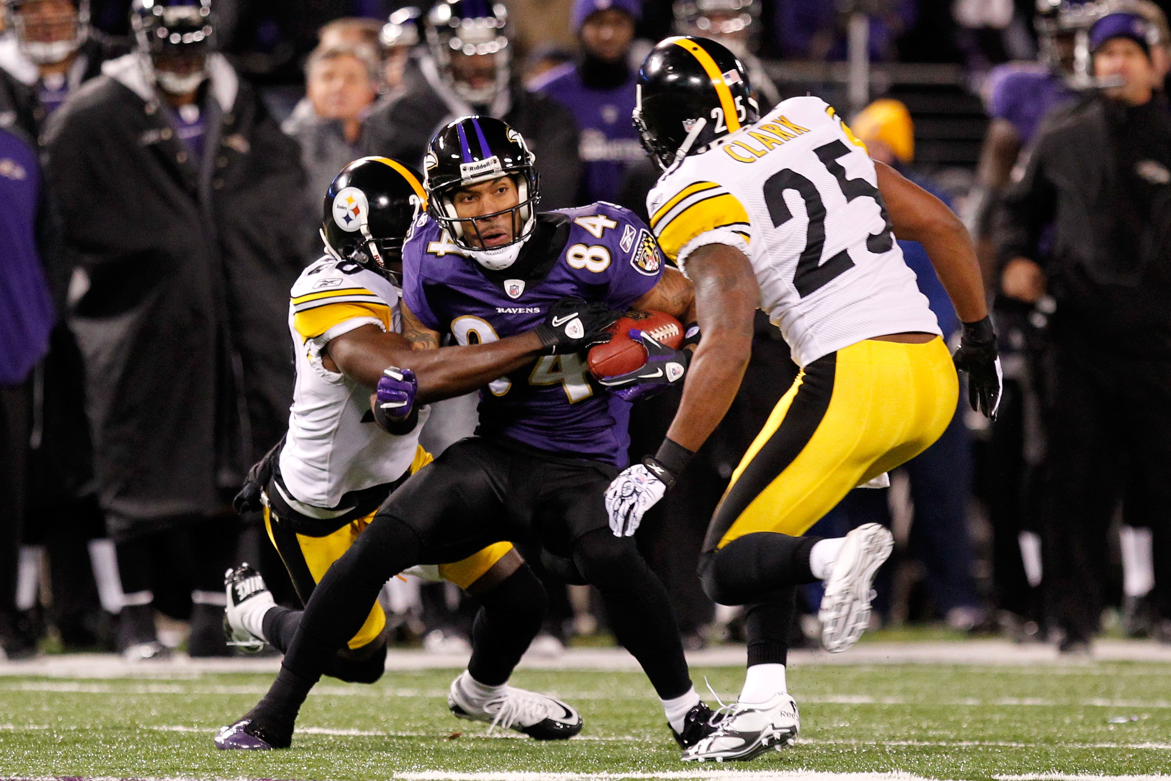 BALTIMORE, MD - DECEMBER 05: T.J. Houshmandzadeh #84 of the Baltimore Ravens holds onto the ball against the Pittsburgh Steelers during the second quarter of the game at M&T Bank Stadium on December 5, 2010 in Baltimore, Maryland. (Photo by Geoff Burke/ BALTIMORE, MD - DECEMBER 05: T.J. Houshmandzadeh #84 of the Baltimore Ravens holds onto the ball against the Pittsburgh Steelers during the second quarter of the game at M&T Bank Stadium on December 5, 2010 in Baltimore, Maryland. (Photo by Geoff Burke/