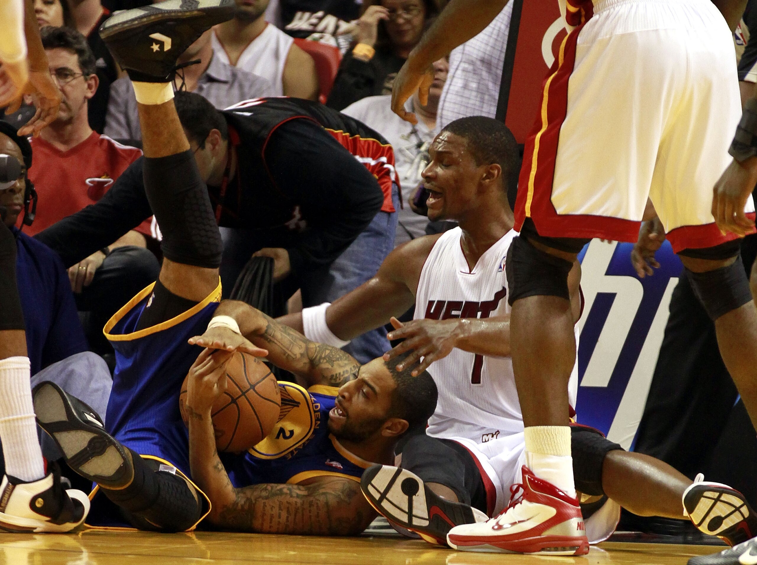 MIAMI, FL - JANUARY 01: Forward Chris Bosh #1 of the Miami Heat rebounds against the Golden State Warriors at American Airlines Arena on January 1, 2011 in Miami, Florida. NOTE TO USER: User expressly acknowledges and agrees that, by downloading and/or MIAMI, FL - JANUARY 01: Forward Chris Bosh #1 of the Miami Heat rebounds against the Golden State Warriors at American Airlines Arena on January 1, 2011 in Miami, Florida. NOTE TO USER: User expressly acknowledges and agrees that, by downloading and/or
