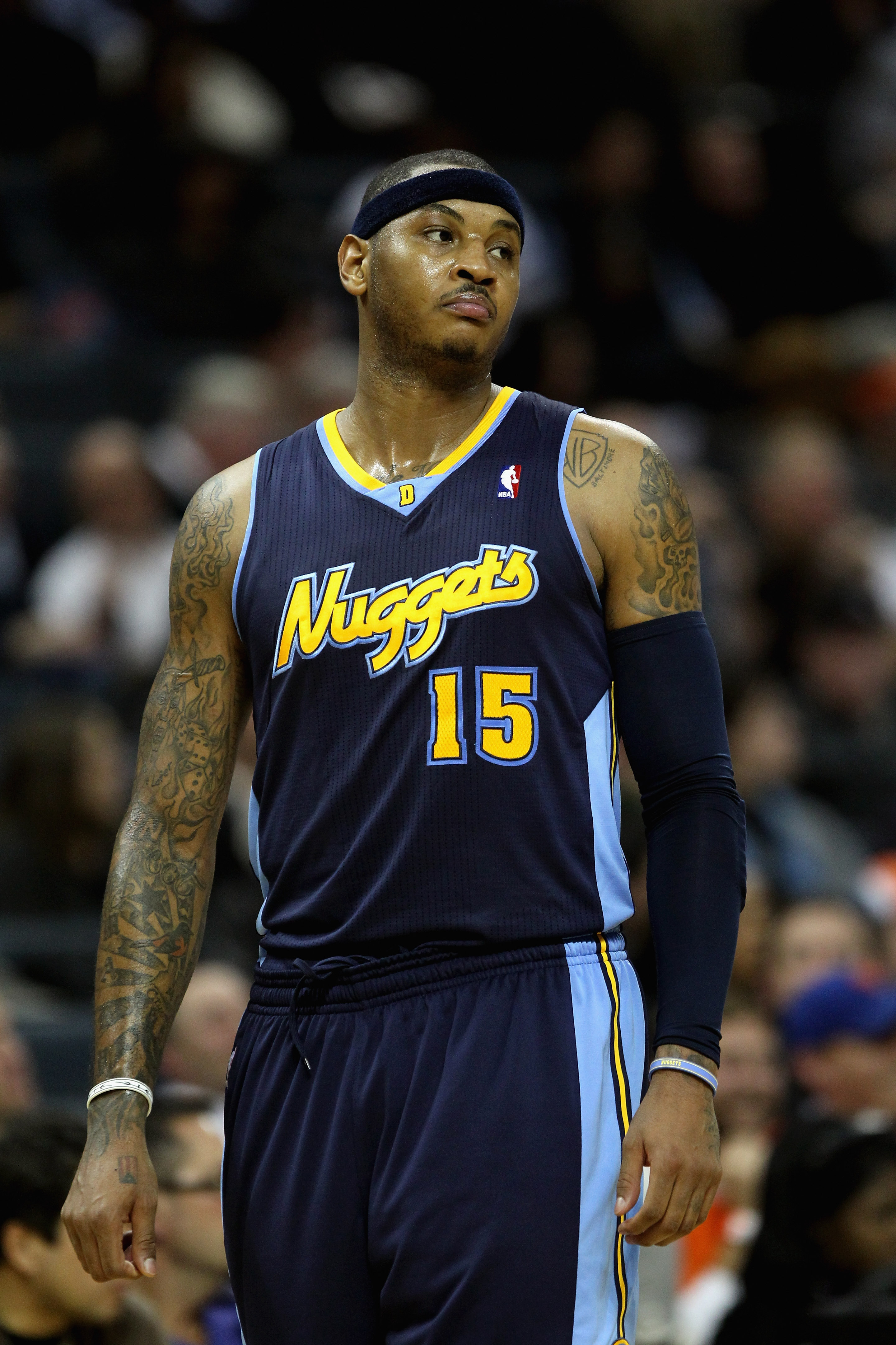 CHARLOTTE, NC - DECEMBER 07: Carmelo Anthony #15 of the Denver Nuggets watches on against the Charlotte Bobcats during their game at Time Warner Cable Arena on December 7, 2010 in Charlotte, North Carolina. NOTE TO USER: User expressly acknowledges and CHARLOTTE, NC - DECEMBER 07: Carmelo Anthony #15 of the Denver Nuggets watches on against the Charlotte Bobcats during their game at Time Warner Cable Arena on December 7, 2010 in Charlotte, North Carolina. NOTE TO USER: User expressly acknowledges and