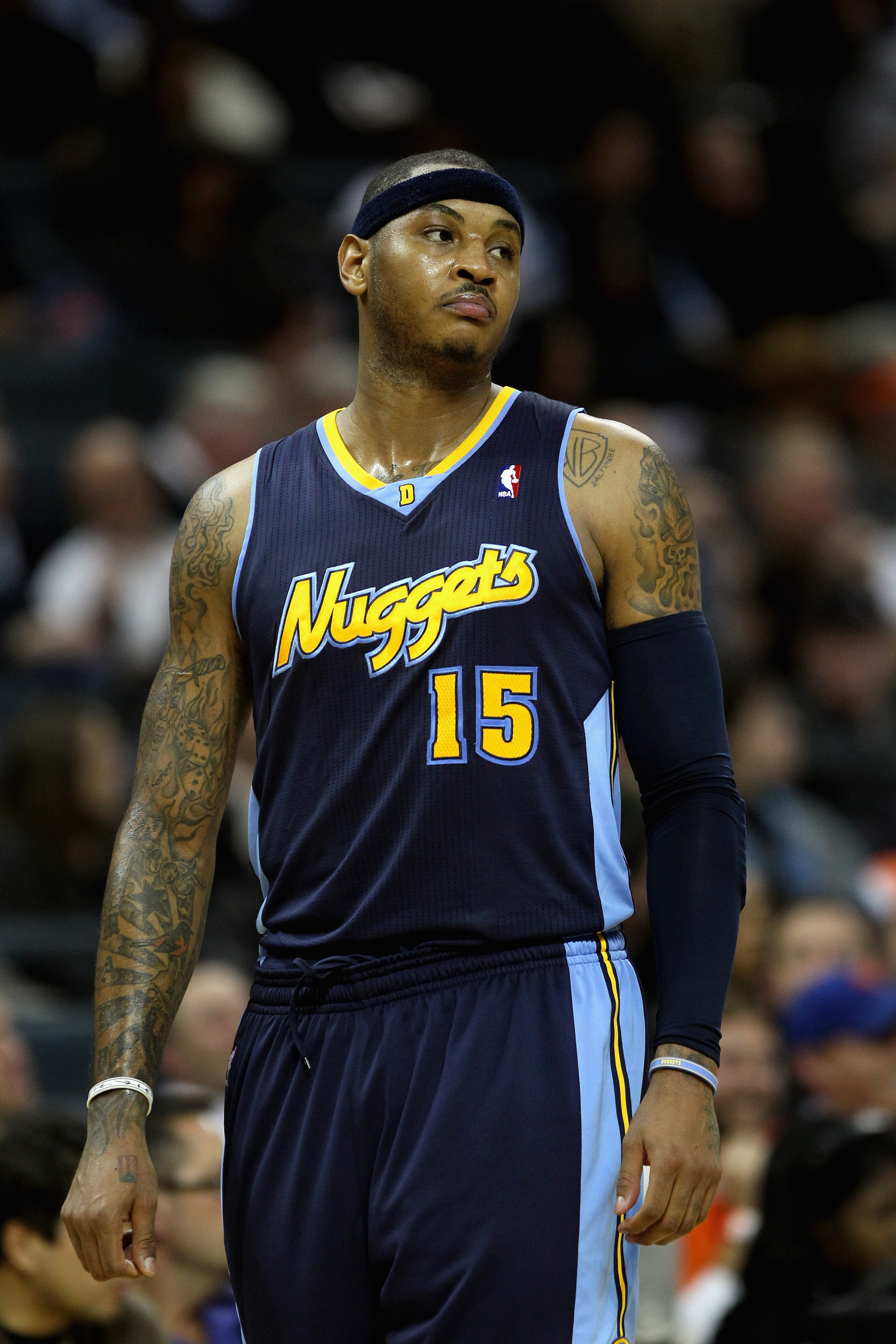 CHARLOTTE, NC - DECEMBER 07: Carmelo Anthony #15 of the Denver Nuggets watches on against the Charlotte Bobcats during their game at Time Warner Cable Arena on December 7, 2010 in Charlotte, North Carolina. NOTE TO USER: User expressly acknowledges and CHARLOTTE, NC - DECEMBER 07: Carmelo Anthony #15 of the Denver Nuggets watches on against the Charlotte Bobcats during their game at Time Warner Cable Arena on December 7, 2010 in Charlotte, North Carolina. NOTE TO USER: User expressly acknowledges and
