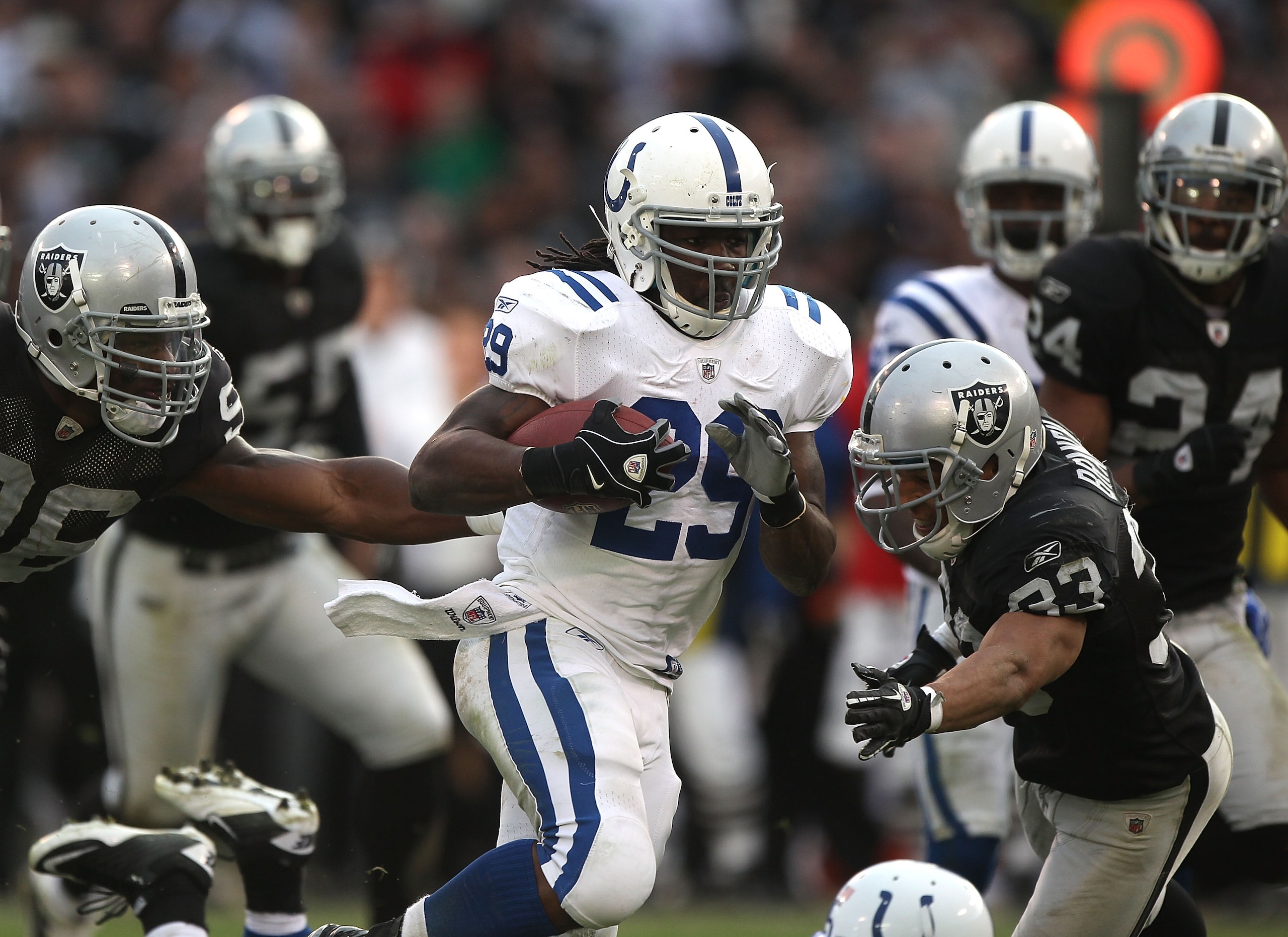 OAKLAND, CA - DECEMBER 26:  Joseph Addai #29 of the Indianapolis Colts runs against the Oakland Raiders during an NFL game at Oakland-Alameda County Coliseum on December  26, 2010 in Oakland, California.  (Photo by Jed Jacobsohn/Getty Images)