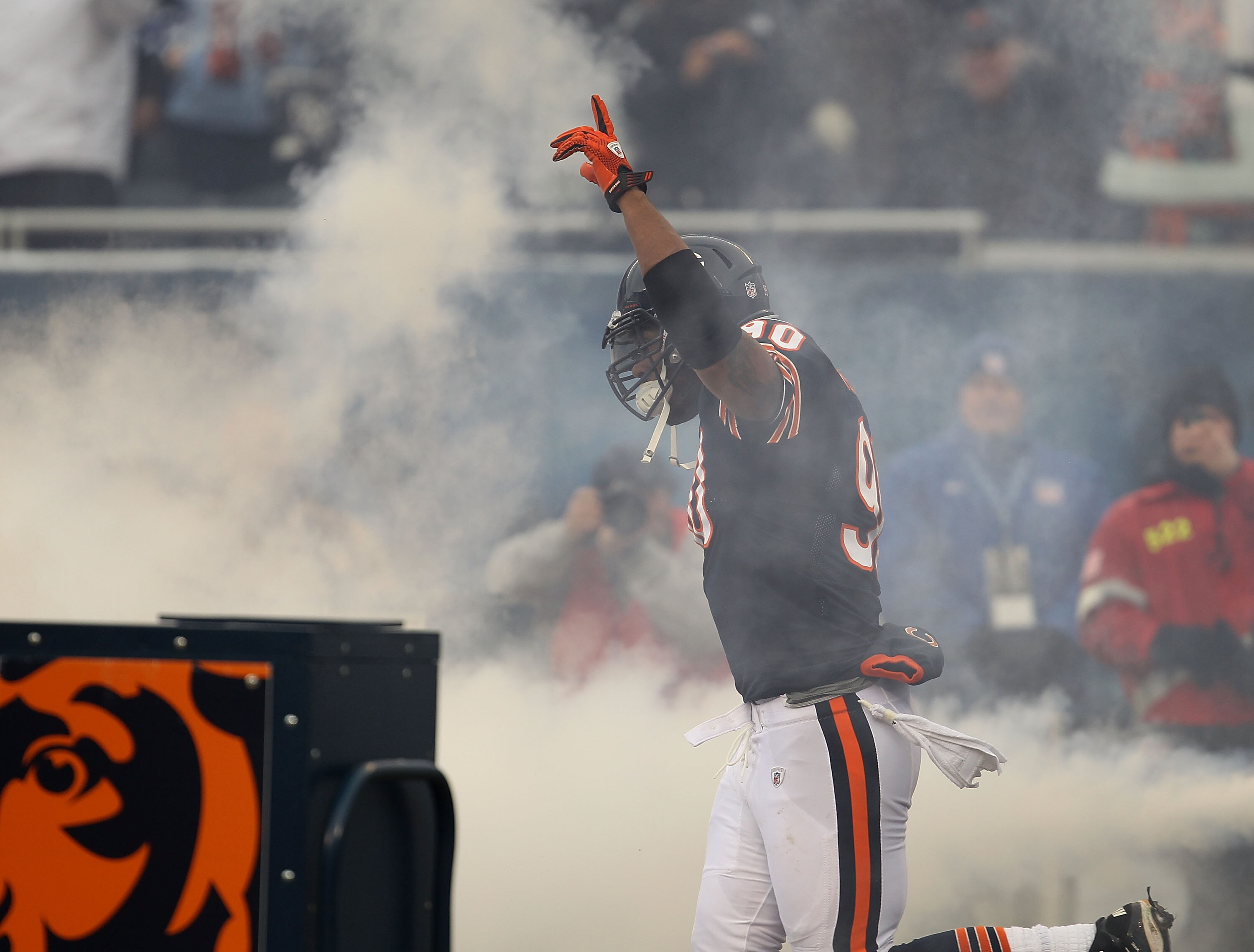 CHICAGO, IL - DECEMBER 26: Julius Peppers #90 of the Chicago Bears runs onto the field during player introductions before a game against the New York Jets at Soldier Field on December 26, 2010 in Chicago, Illinois. The Bears defeated the Jets 38-34.  (Pho
