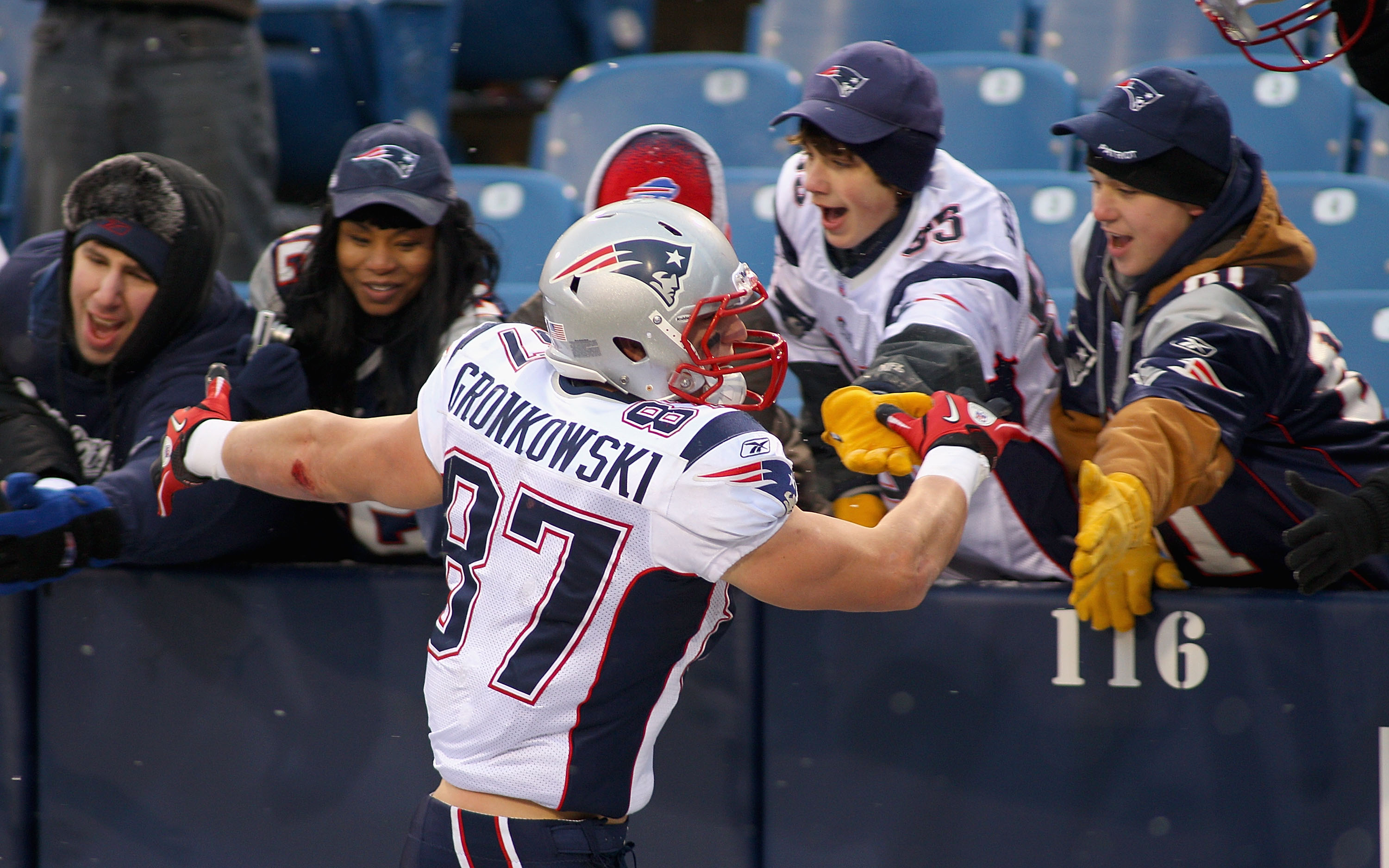 ORCHARD PARK, NY - DECEMBER 26: Rob Gronkowski #87 of the New England Patriots celebrates with fans after playing the Buffalo Bills at Ralph Wilson Stadium on December 26, 2010 in Orchard Park, New York. Gronkowski is a Buffalo native and had two touchdow