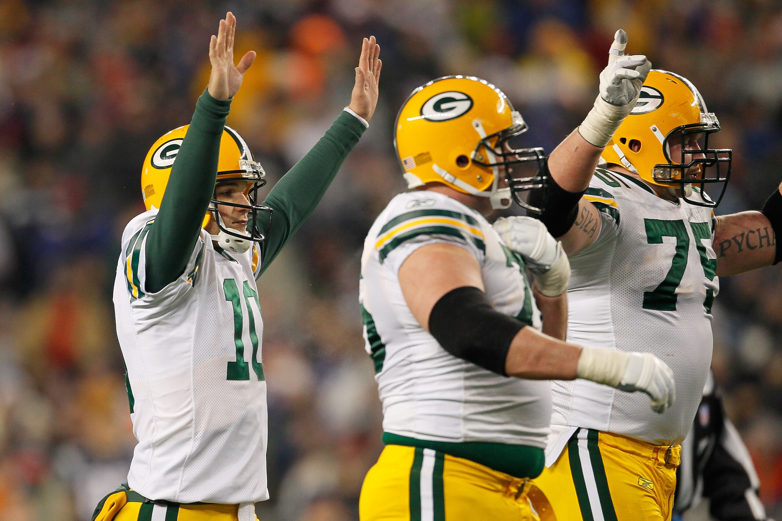 FOXBORO, MA - DECEMBER 19:  Quarterback Matt Flynn #10 of the Green Bay Packers and teammates celebrate a touchdown during the third quarter of the game against the New England Patriots at Gillette Stadium on December 19, 2010 in Foxboro, Massachusetts.