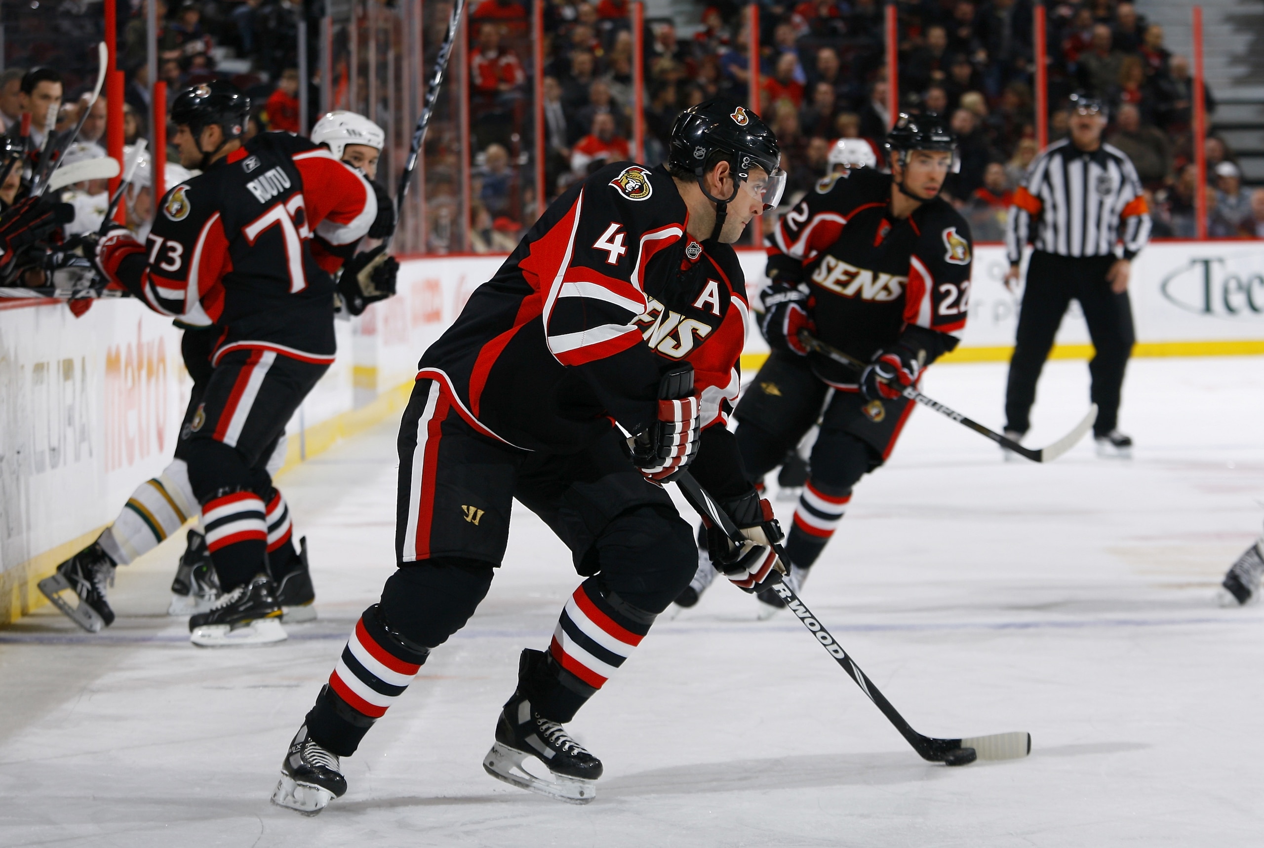 OTTAWA, ON - NOVEMBER 24: Chris Phillips #4 of the Ottawa Senators looks to make a cross ice pass during a game against the Dallas Stars at Scotiabank Place on November 24, 2010 in Ottawa, Ontario, Canada. (Photo by Phillip MacCallum/Getty Images)