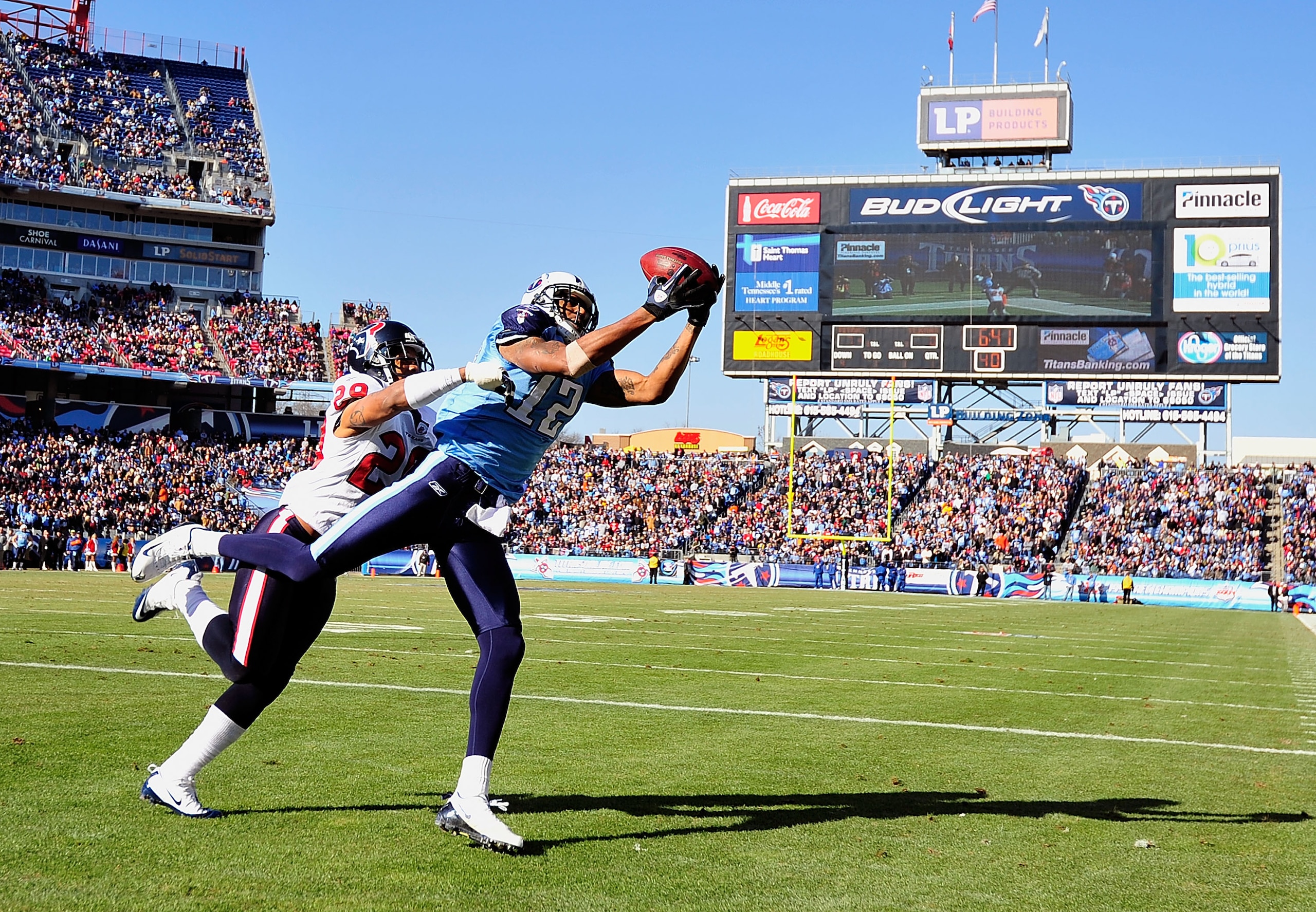 NASHVILLE, TN - DECEMBER 19:  Justin Gage #12 of the Tennessee Titans makes a touchdown catch against Glover Quin #29 of the Houston Texans during the first half at LP Field on December 19, 2010 in Nashville, Tennessee.  (Photo by Grant Halverson/Getty Im