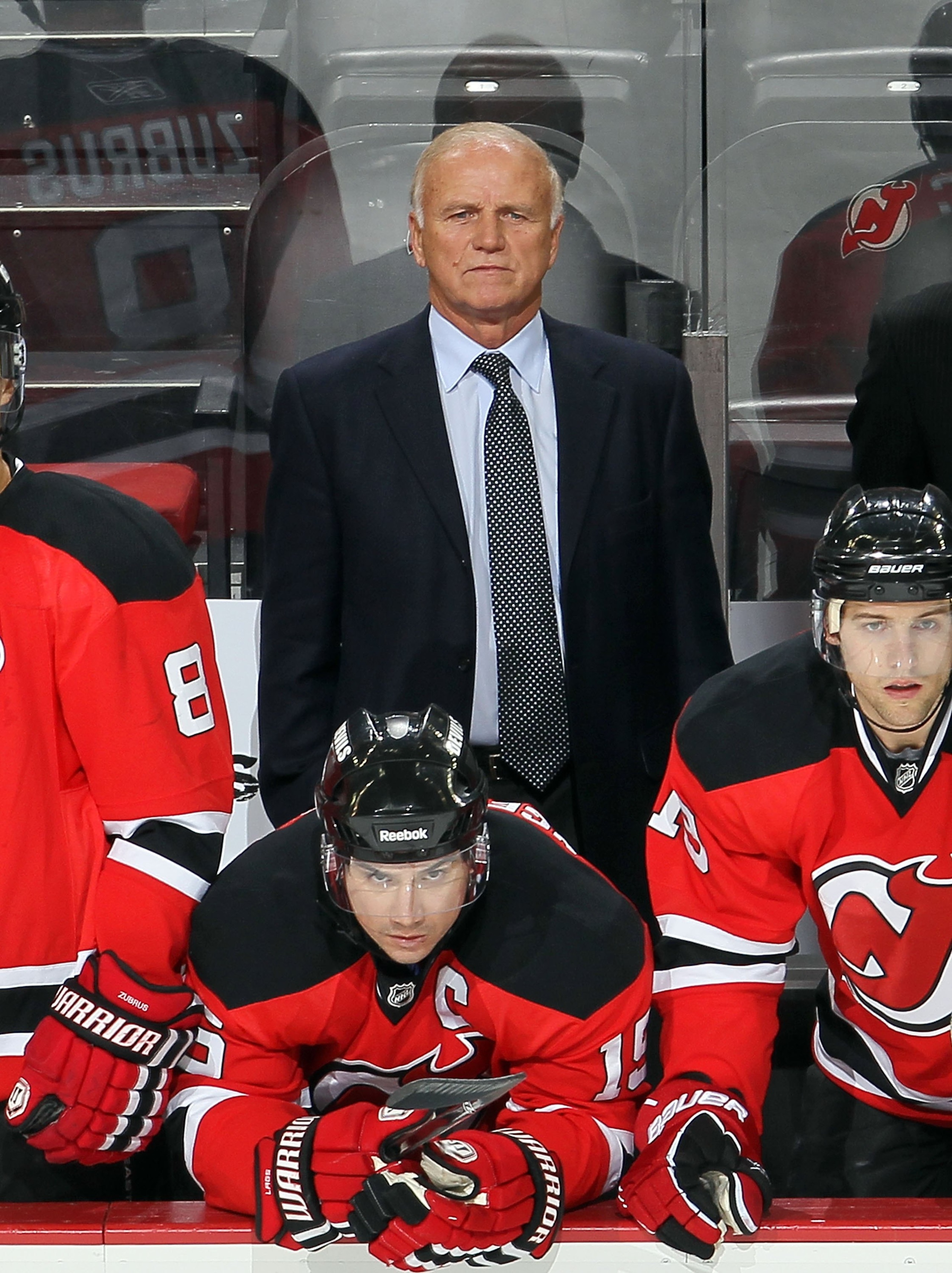 NEWARK, NJ - DECEMBER 23:  Head coach Jacques Lemaire of the New Jersey Devils looks on against the New York Islanders at the Prudential Center on December 23, 2010 in Newark, New Jersey.  (Photo by Jim McIsaac/Getty Images)